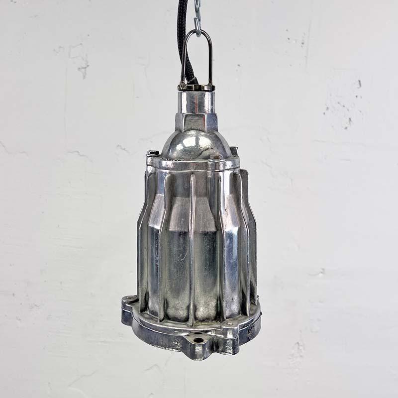 Small industrial spot lighting made from cast aluminium with a glass shade over the lamp. Original explosion proof fittings originally used on supertankers. Manufactured by HRLM Technology Company, a Chinese manufacturer of explosion proof fixtures