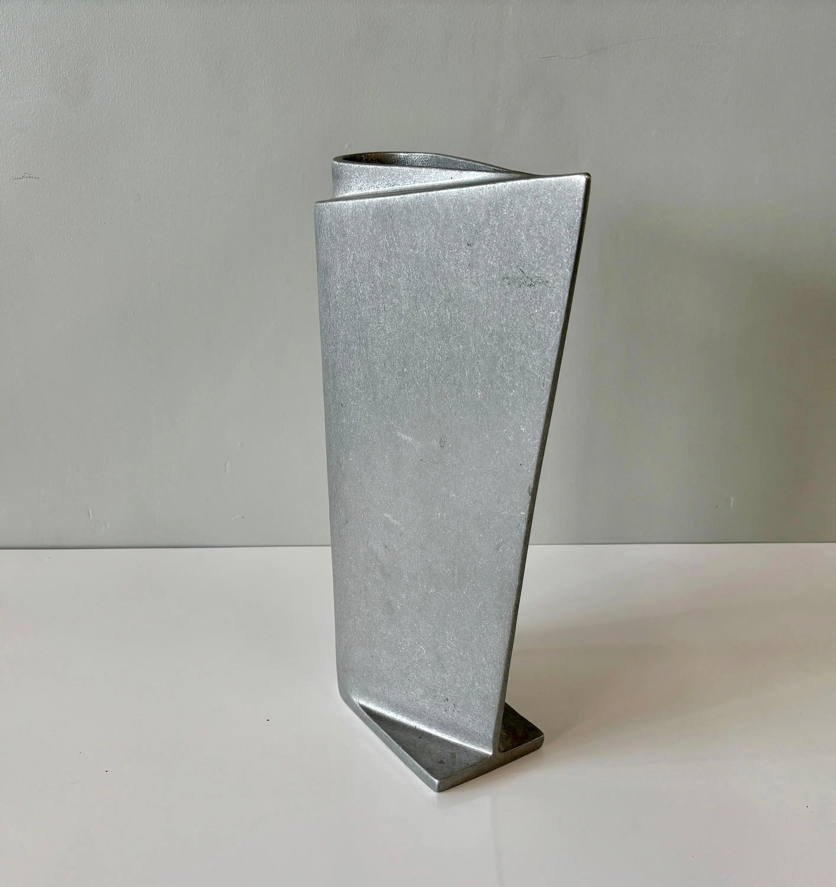Super unique solid cast aluminum vase. Boldly designed and custom made from the 1990s. A very rare and standout piece for those with an eye for modernist design. 

4
