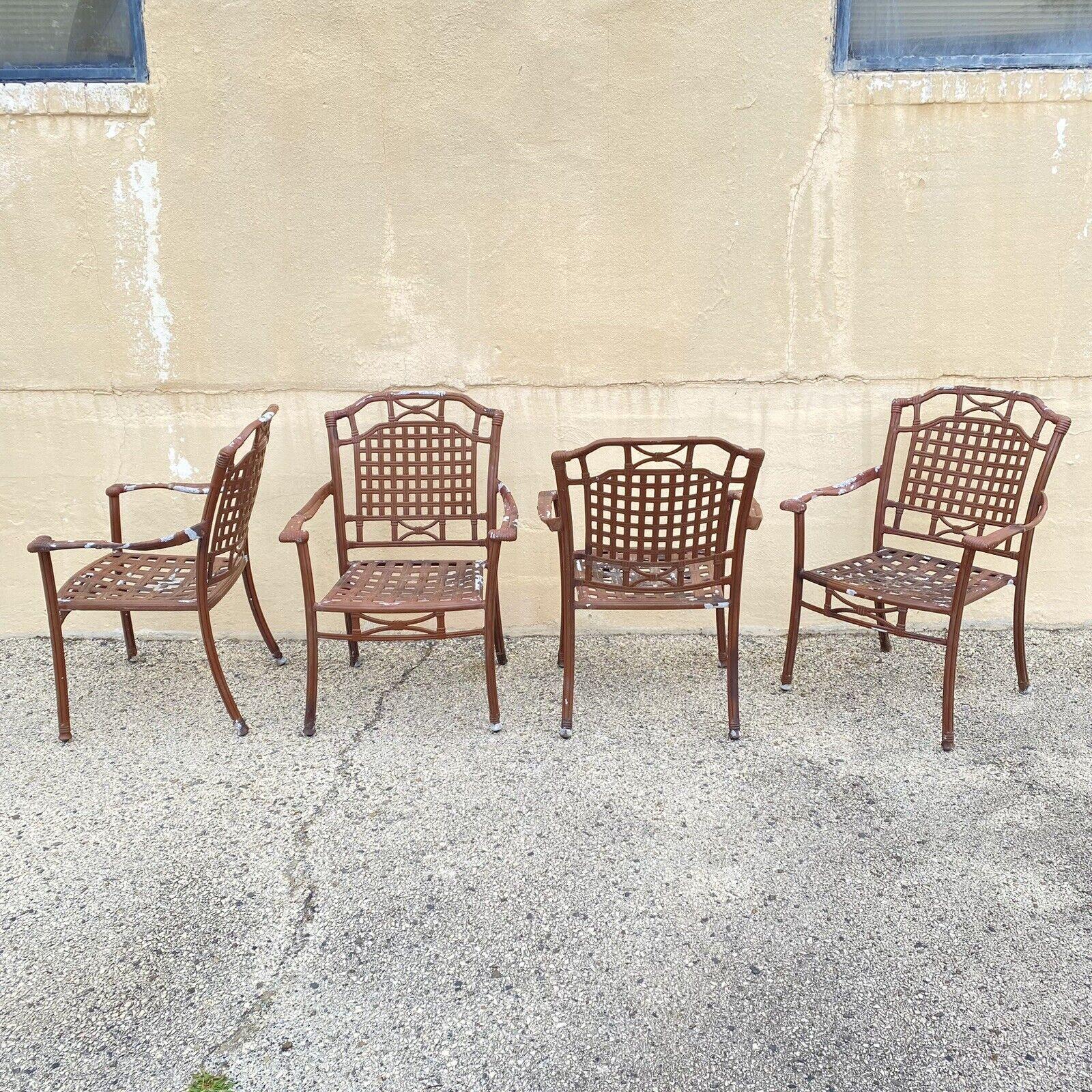 Cast Aluminum Basket Weave Lattice Rattan Patio Outdoor Arm Chairs - Set of 4. Item features stacking frames, cast aluminum construction, great style and form. Circa Late 20th - 21st Century. Measurements: 36.5