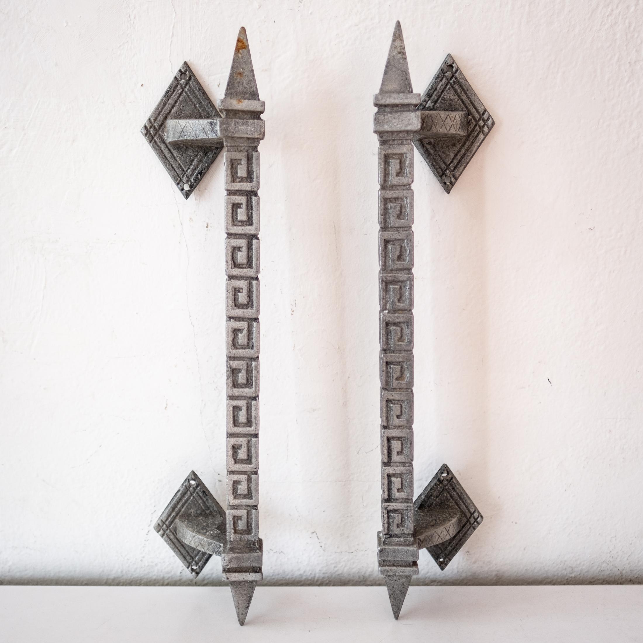 A pair of cast aluminum large door or gate pulls. The pattern is reminiscent of Frank Lloyd Wright's textile block design. Suitable for outdoor use. Nice patina. 1950s