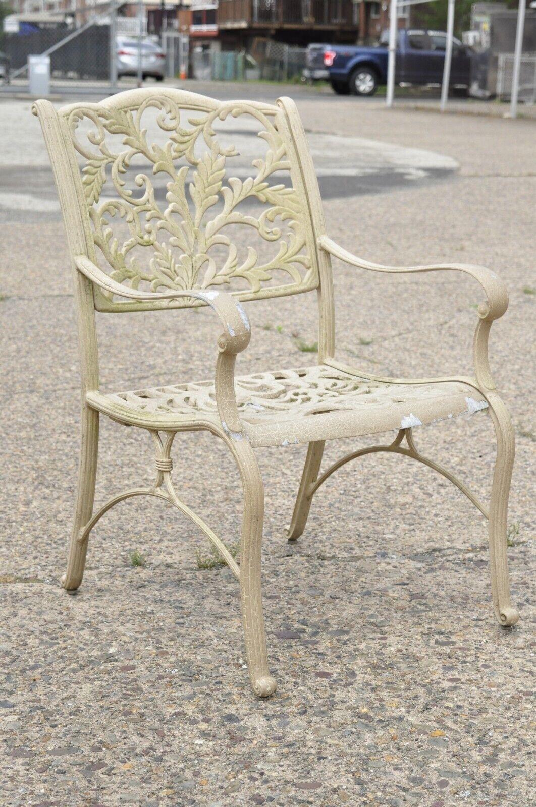 Cast aluminum leafy scroll outdoor patio dining arm chairs - set of 4.
***(2) sets of 4 available***. Cast aluminum construction, leafy scroll design, beige finish, great style and form. Circa late 20th - early 21st century.
Measurements: 37