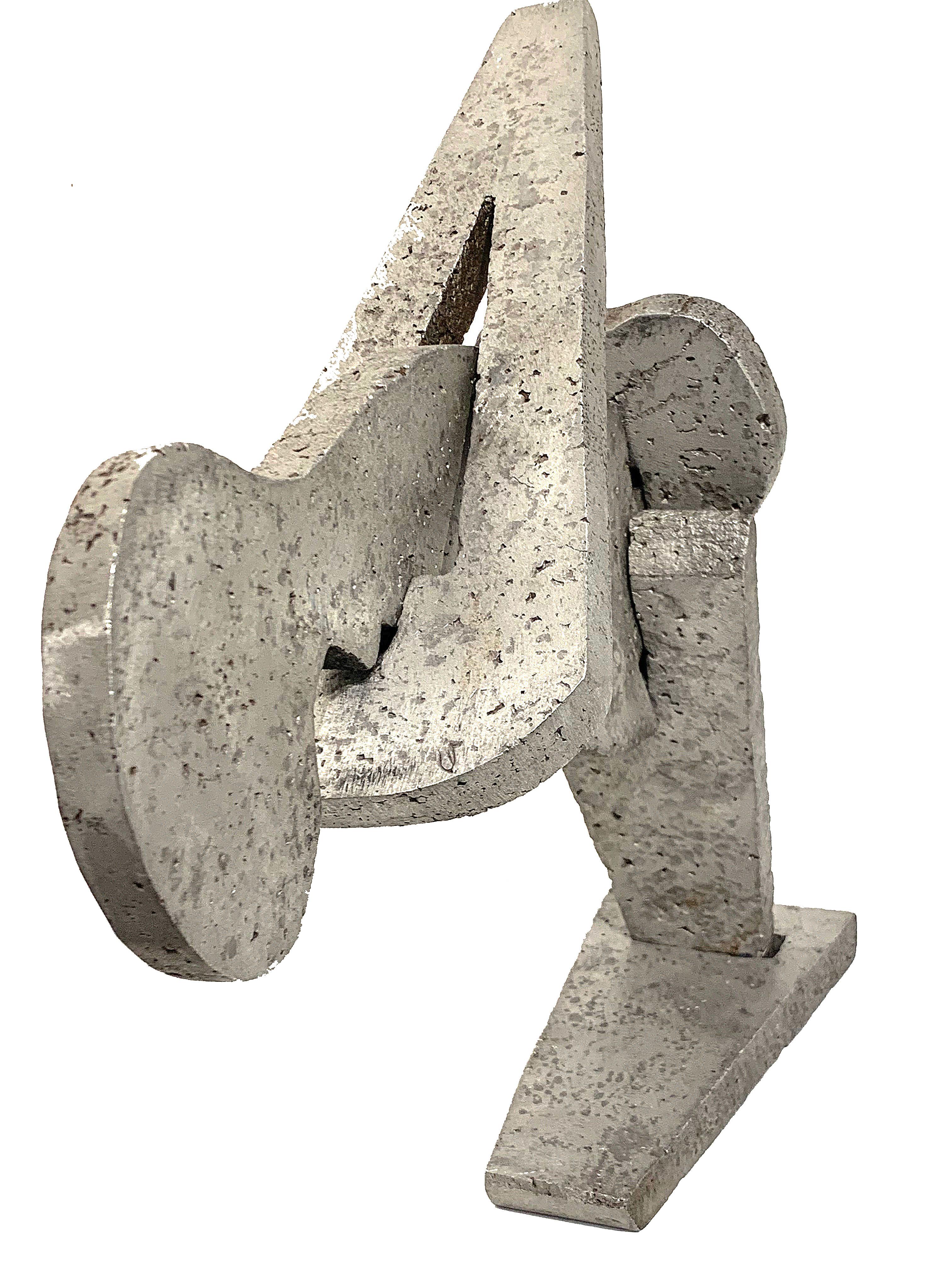Cast aluminum puzzle bird sculpture. Depending on angle, could also be viewed as a swimmer (until one notices the tail). This piece should be placed in a location where won't be handled too much, as the pieces interlock loosely.
