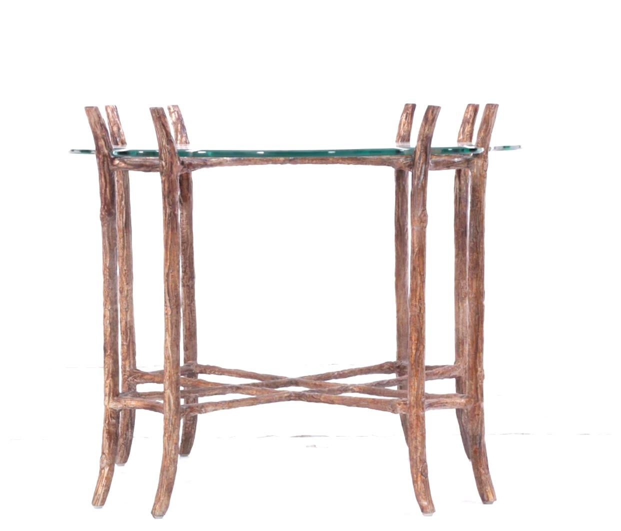 Cast aluminum and hand painted faux bois finished glass top side table. At first glance this beautiful table appears to be made of tree branches. The faux bois finish is quite realistic. The beveled glass top is cut to fit the double legged