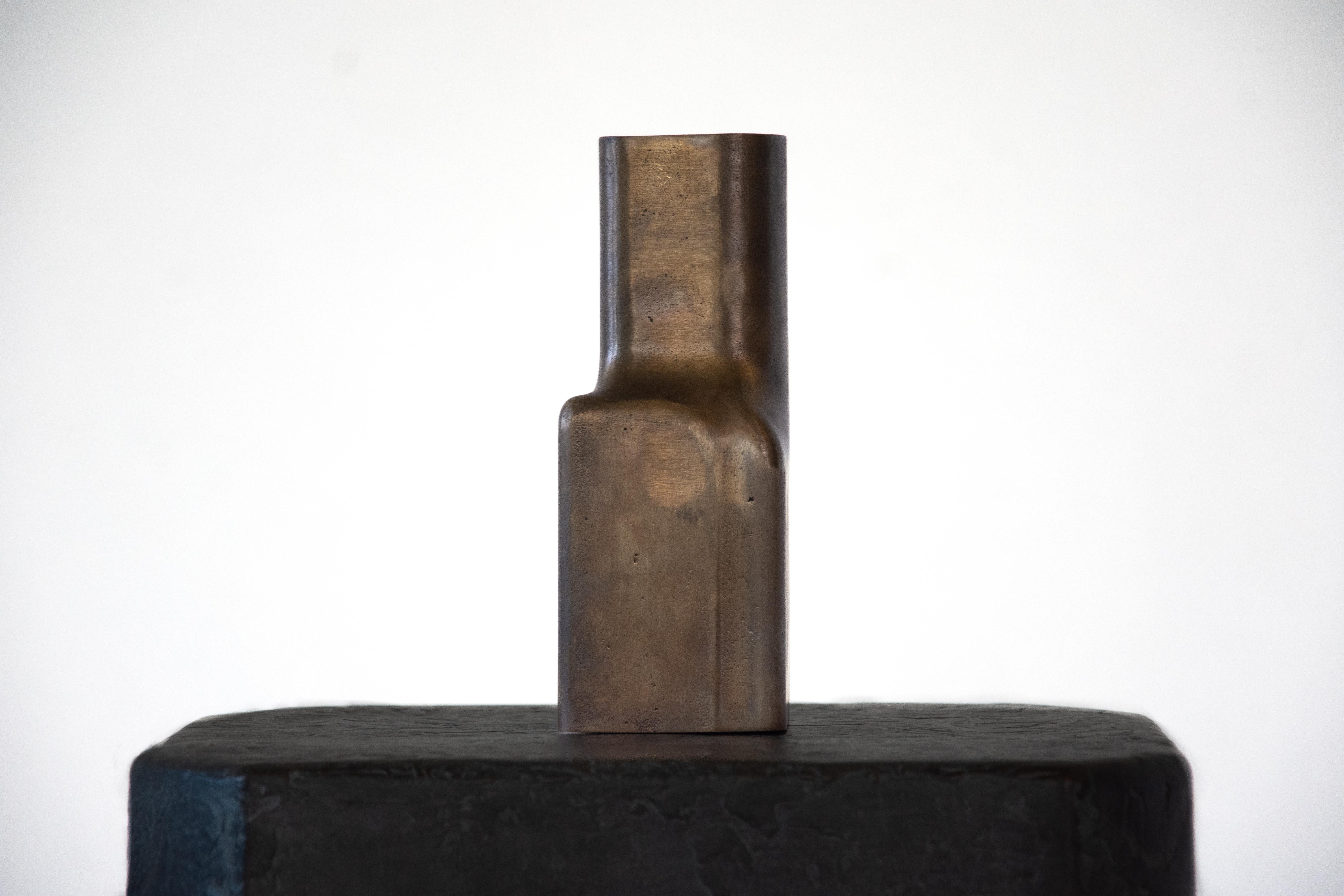 Cast and Patinated Bronze Flos Vase by Eichkorn
Dimensions: W 7 x D 7 x H 18 cm
Materials: cast & patinated bronze.

Flos is reduction in its most elemental form. Cast from solid bronze, it remains raw – in both silhouette and surface. No polish, no