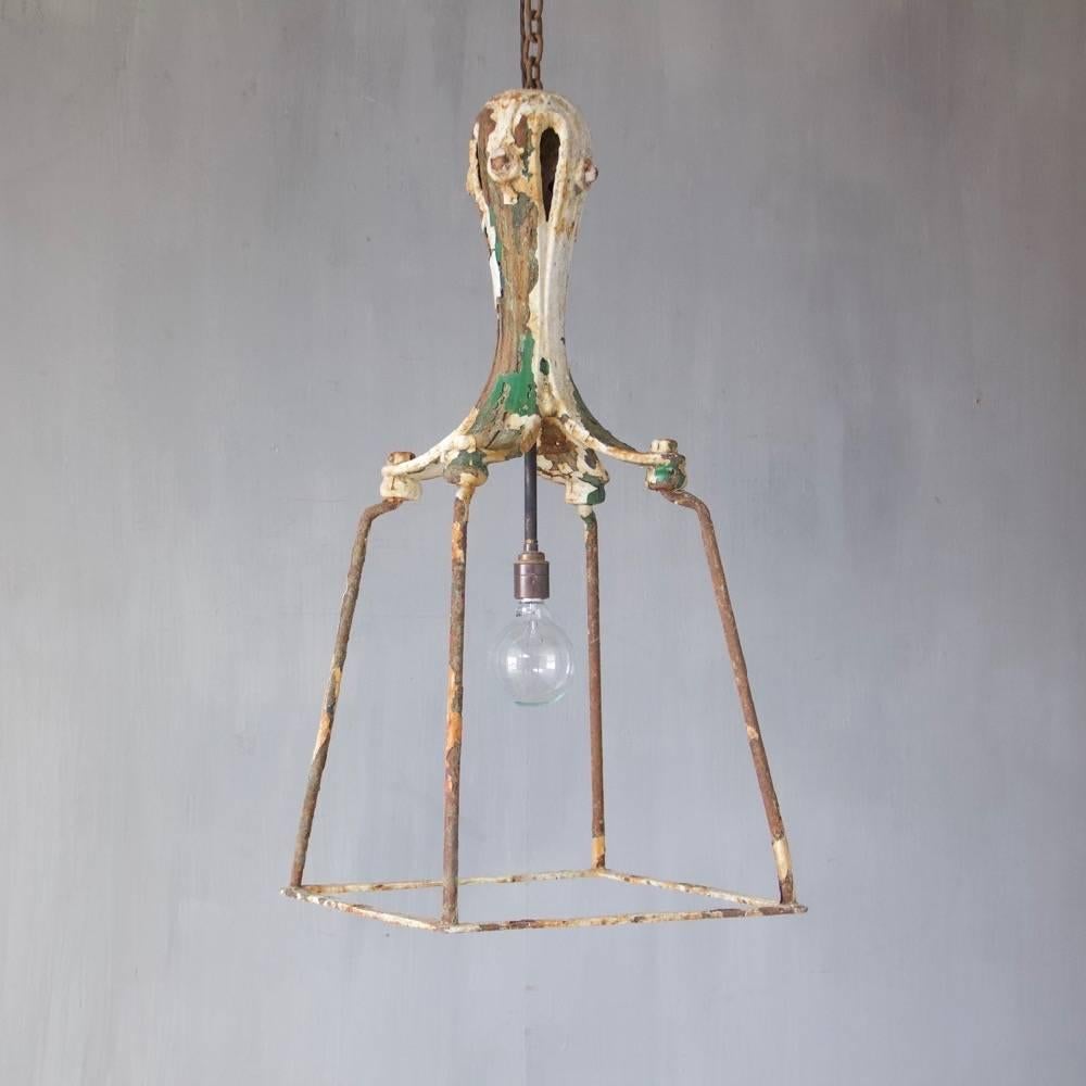 A 19th century cast and wrought iron lantern, England, circa 1850. Wired and ready to hang. Ceiling roses, chain and hooks may be ordered separately.