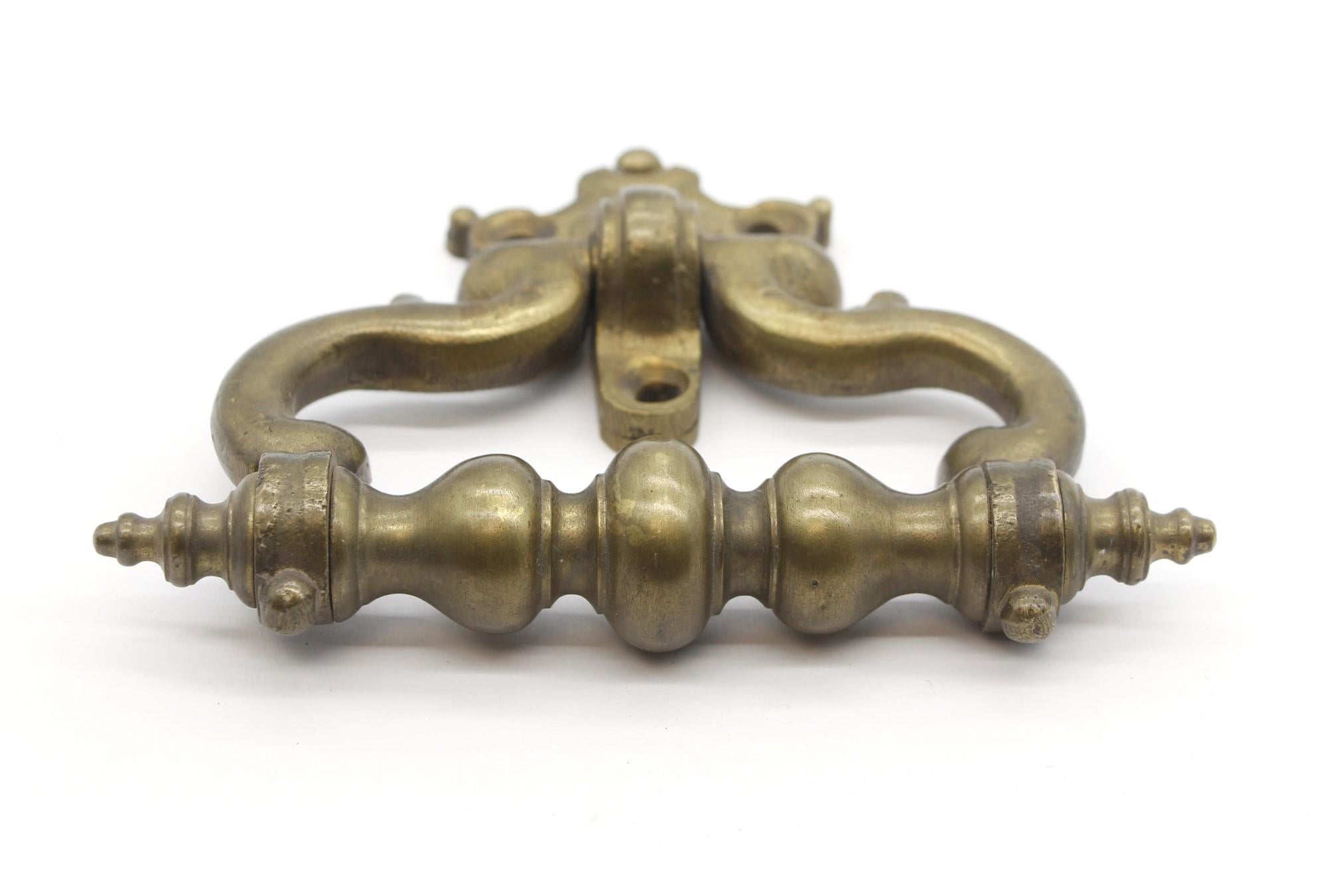 Beefy and solid brass door knocker or handle. Takes three mounting screws. (Not supplied.)