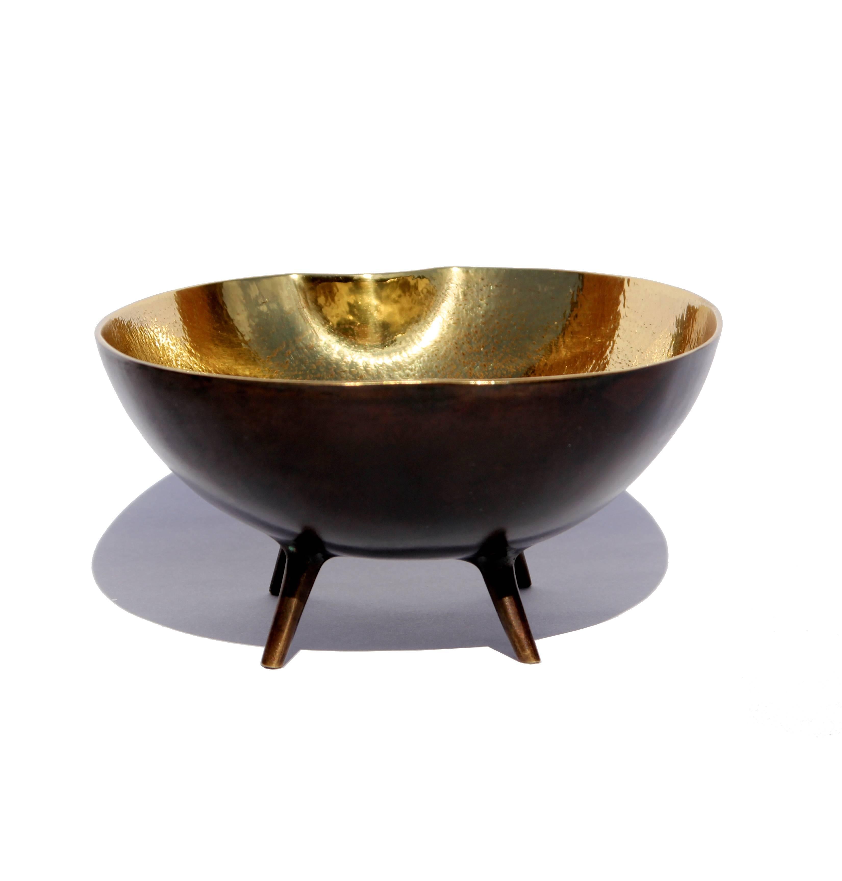 Handmade cast brass bowl legs with a bronze patina on the outside and textured polished brass on the inside.

Each of these charming, original and elegant bowls is handmade individually. Cast using very traditional techniques, the noble material