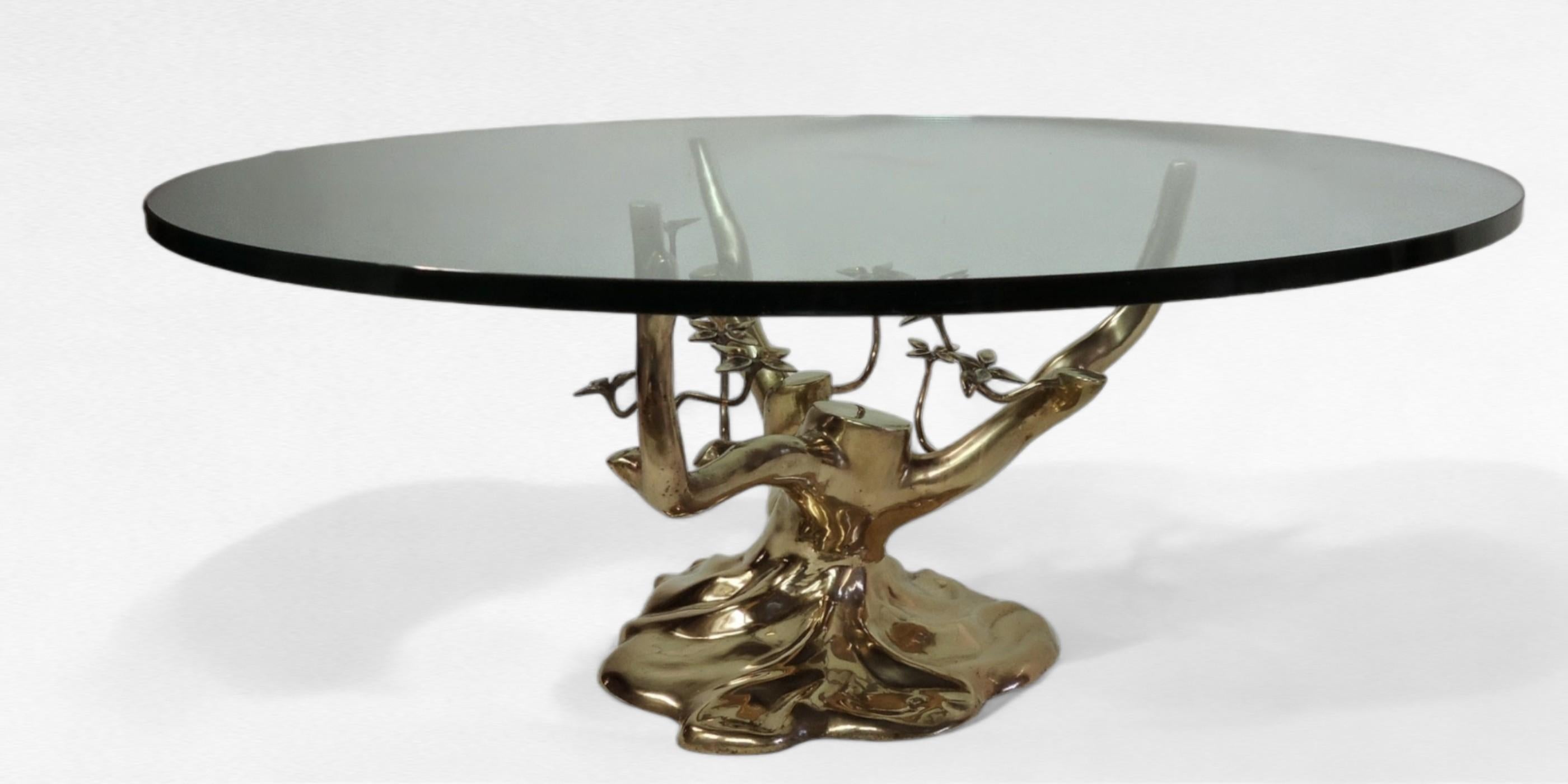 A polished cast brass bonsaii trunk base attributed to the Belgian designer Willy Daro. 
Beautifully executed.
The table is in good condition with wear typical of its age.