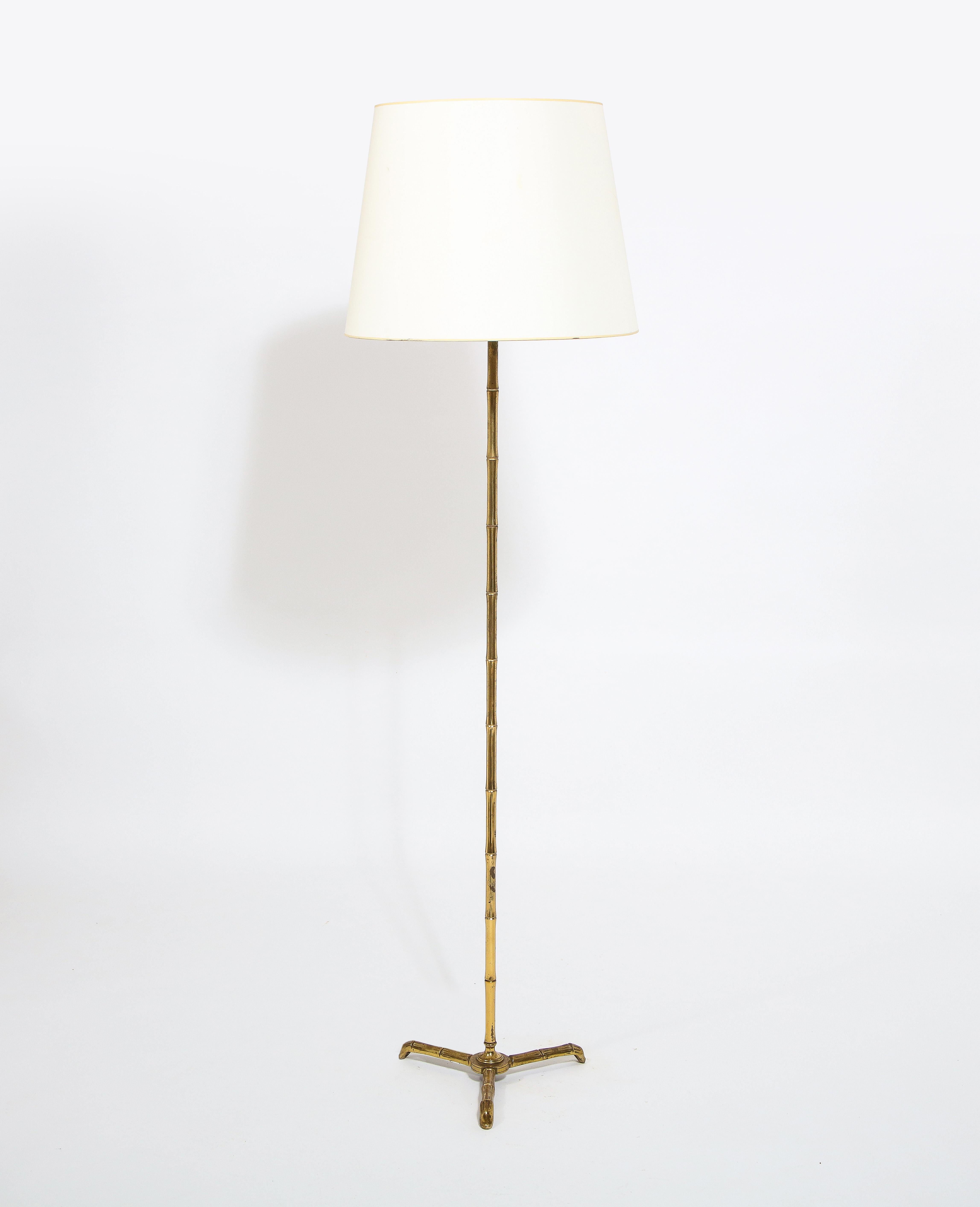 A cast brass faux bamboo lamp with a very nice texture and patina. Shade is for photographic purposes only.