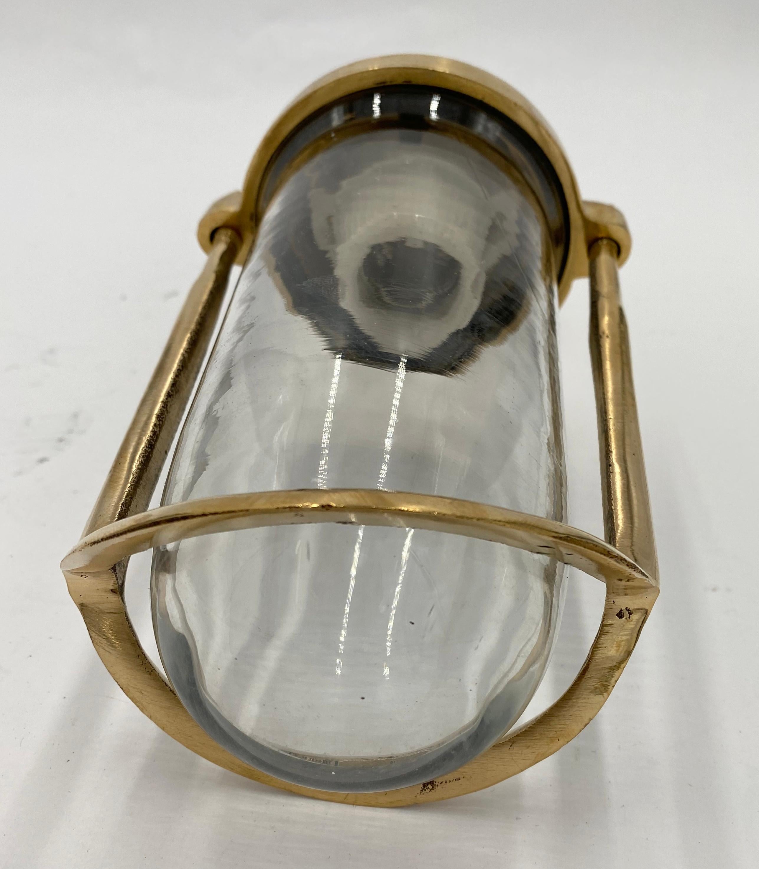 Slim sleek polished brass nautical ship wall sconce light. Takes one standard E26 light bulb. Cleaned and rewired. Small quantity available at time of posting. Please inquire. Priced each. Please note, this item is located in one of our NYC
