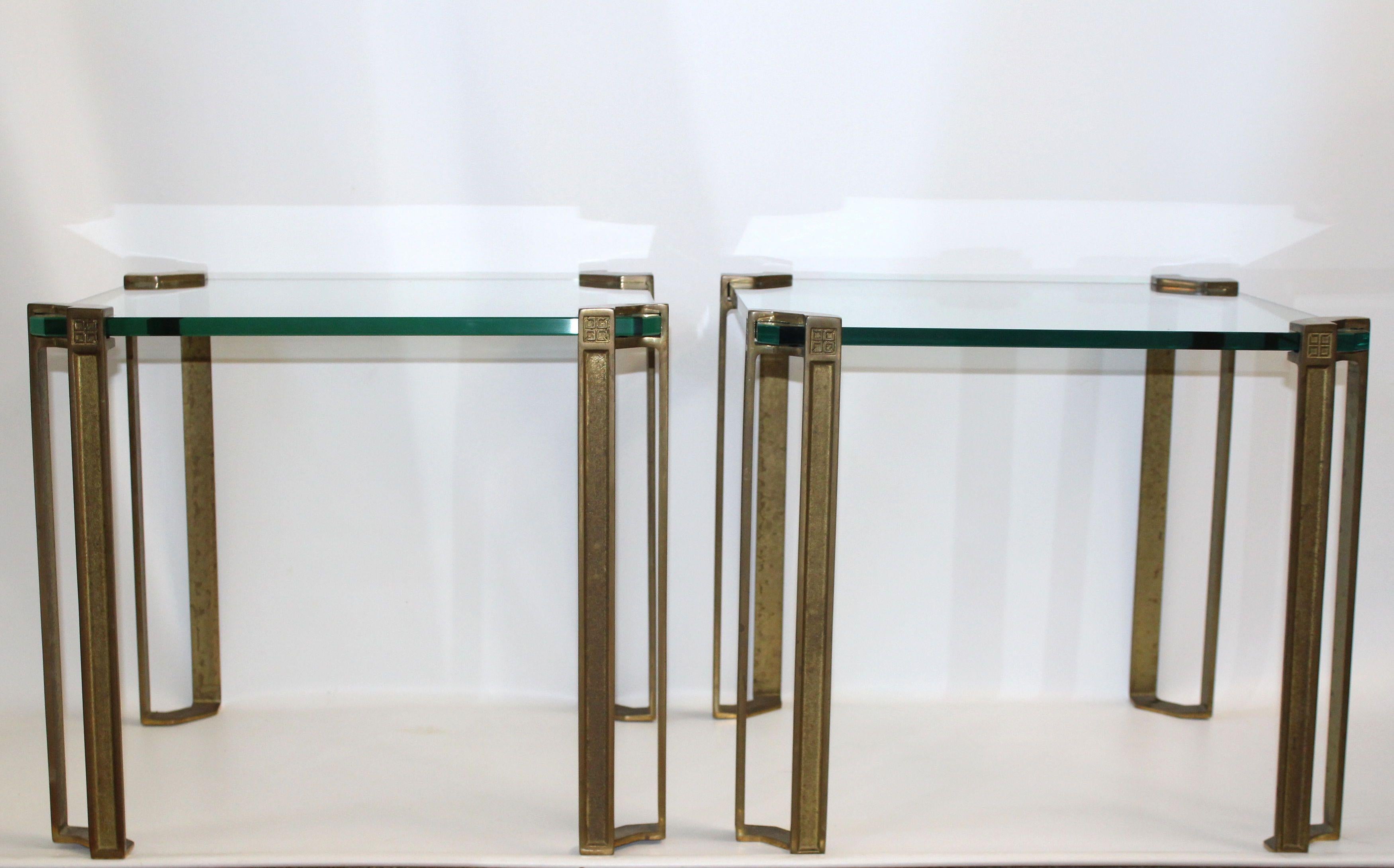 1970's German designer Peter Ghyczy pair cast bronze and thick glass side tables.
Signature logo on each corner.
Natural patina.
