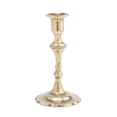 Cast brass Queen Anne petal base candlestick, c. 1760