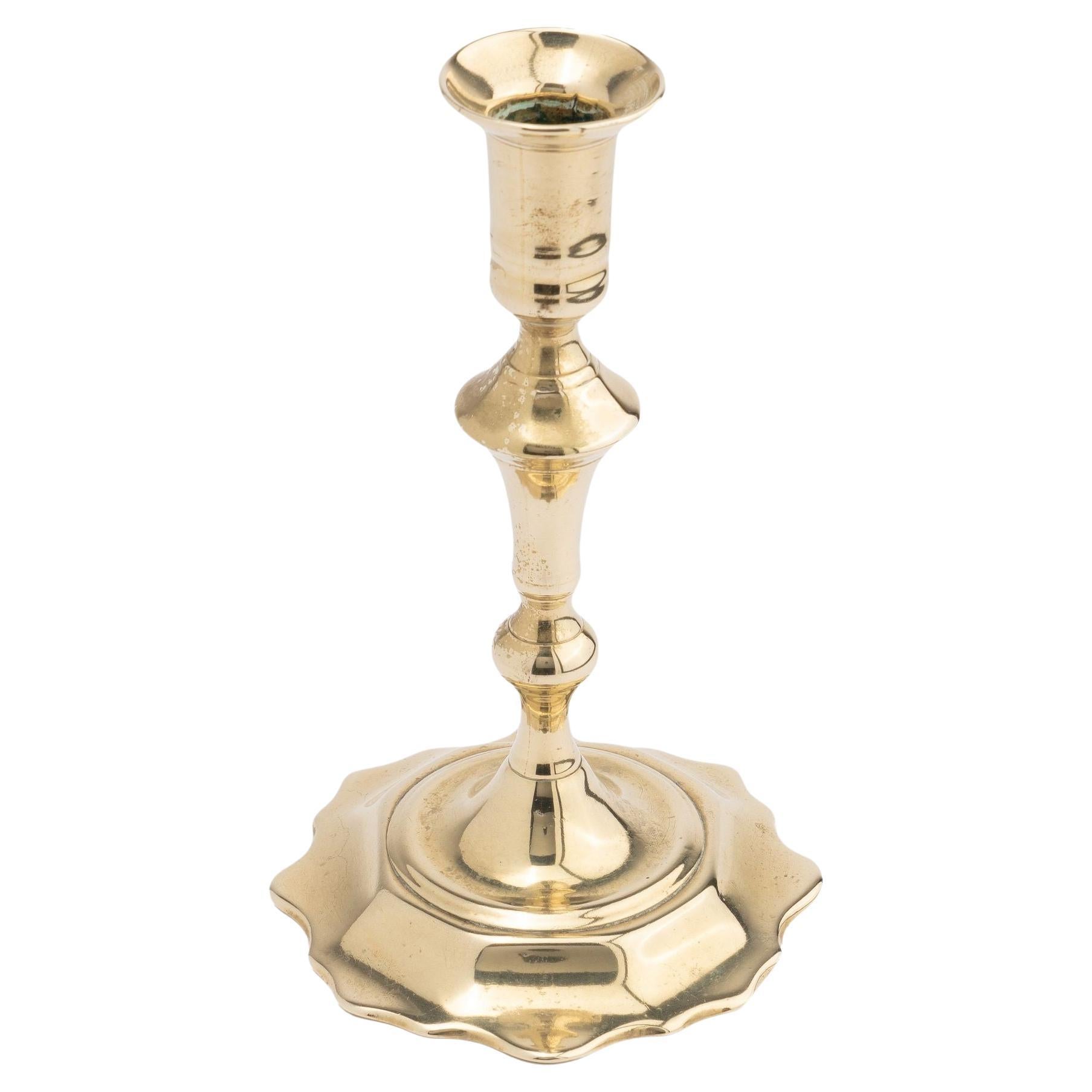 Cast brass Queen Anne scollop base candlestick, c. 1760 For Sale