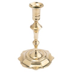 Used Cast brass Queen Anne scollop base candlestick, c. 1760
