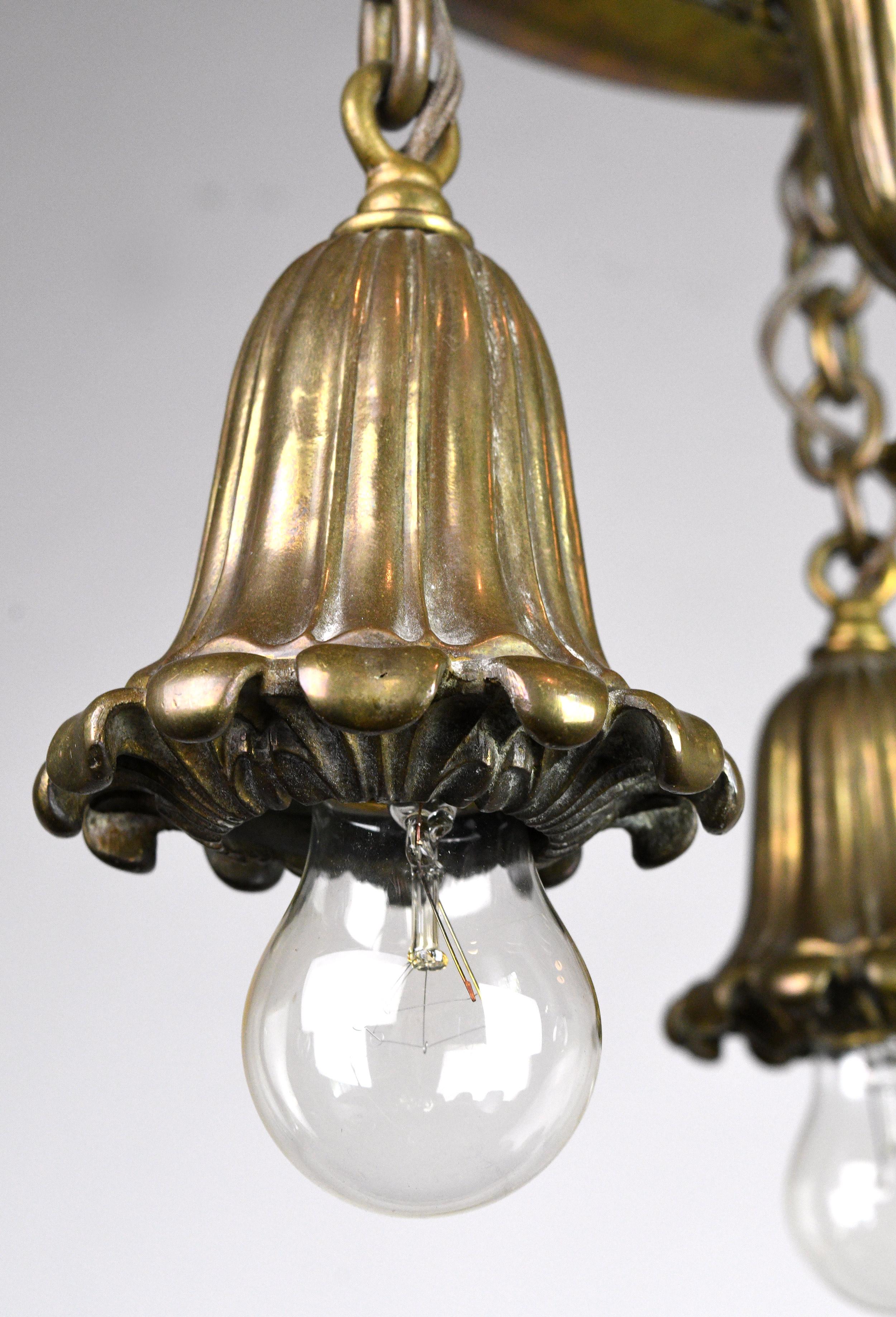 Elegant three-light cast brass bare bulb flush mount with a circular pan canopy. The brass has the perfect amount of luster; it’s bold, yet not over the top shiny. And organic detailing and ribbing on the body and arms add texture and visual