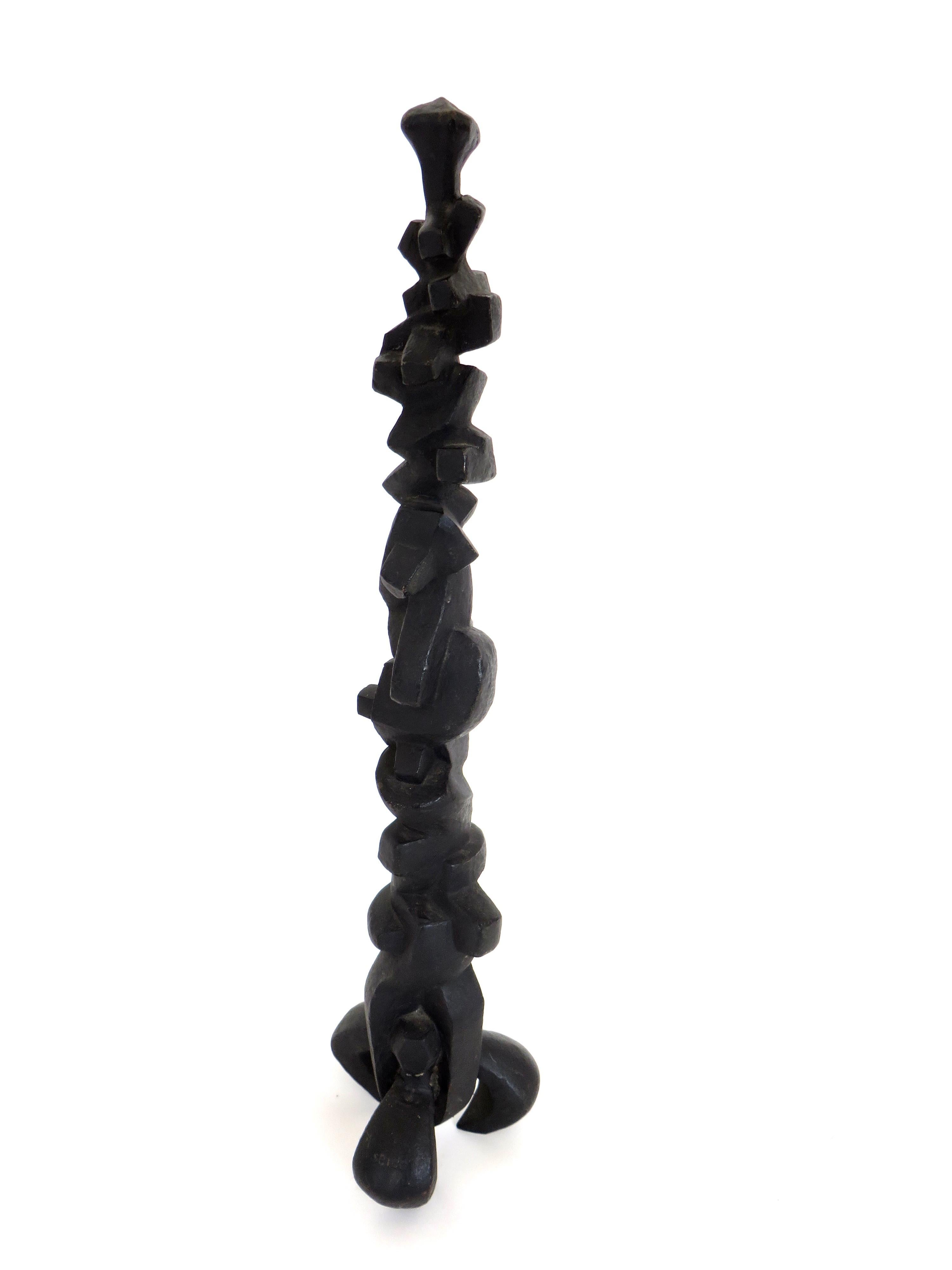 Cast bronze abstract TOTEM sculpture consisting of stacking abstract forms, some geometric, some interlocking.
Heavily blackened bronze sculpture, consisting of abstracted forms, ending on three feet.
Signed on one of the feet. Unreadable