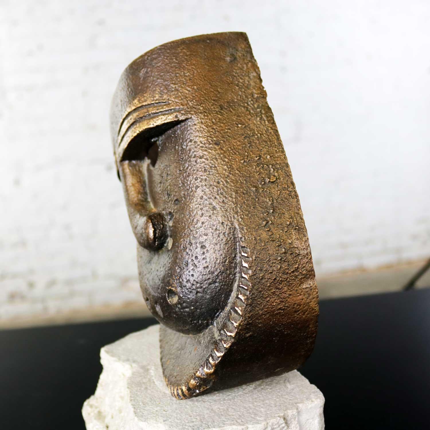 Cast Bronze African Mask Sculpture with Crooked Nose Mounted on Limestone Stand 4