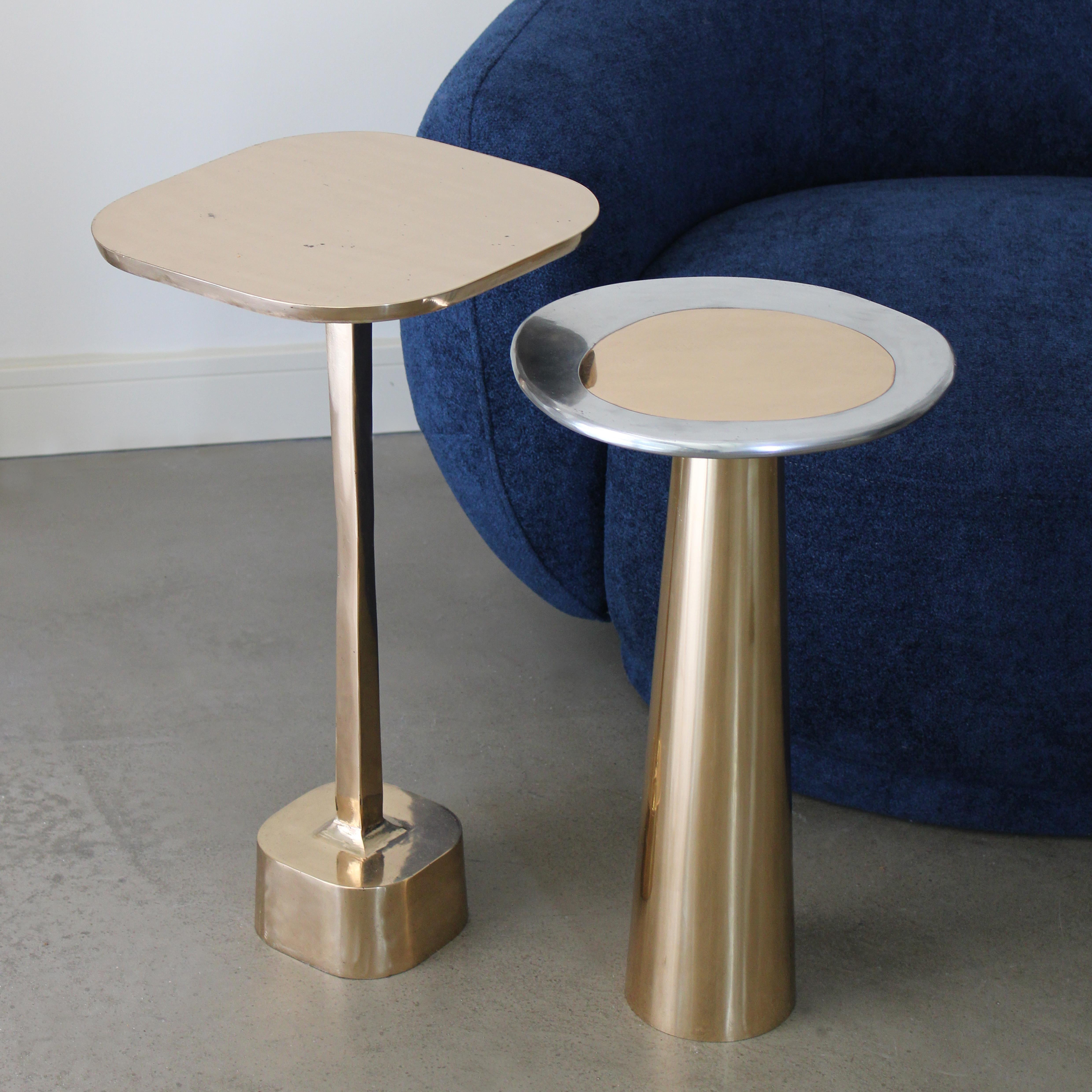 The Cone Table is inspired by the interconnections between the elements and life forms. The conical shape of the base, the asymmetrical form of the top, and the rounded edges provide the table with a silky appearance.

Cone Table, made of bronze