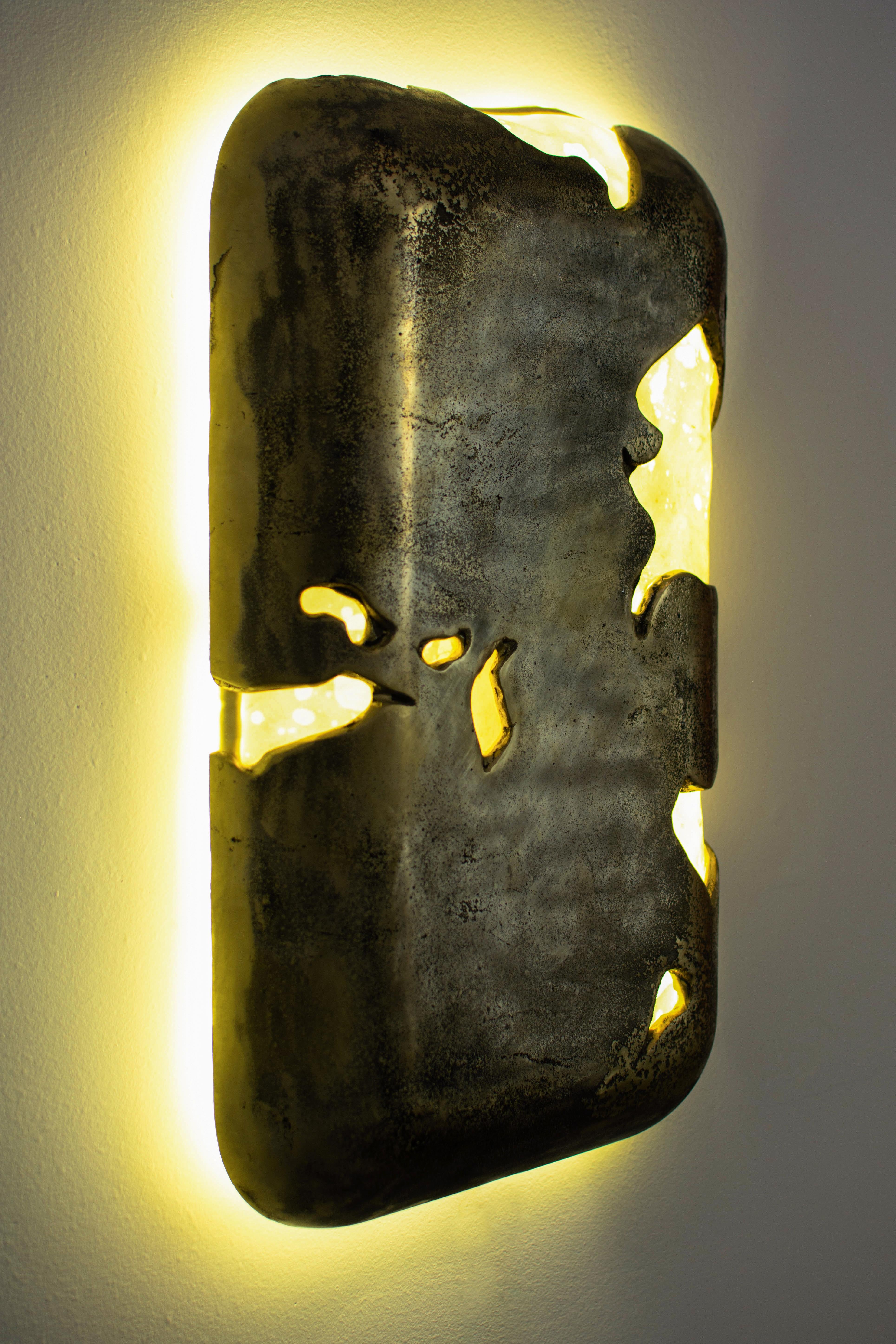 WCS2106 is a one-of-a-kind work of art and functional sconce made from cast bronze, Argentine goatskin and LED by artist and designer William C Stuart, founder of Costantini Design. 

Measurements are 12