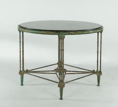 Tisch aus gegossener Bronze und Steinplatte