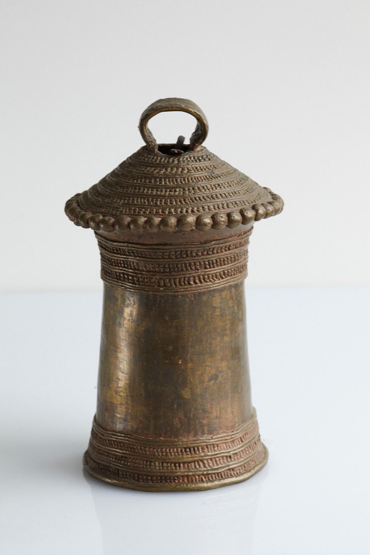 Heavy traditional Benin cast bronze bell with fine decorative bead ornaments on the shoulder and a nice deep and full sound. These bells were used to summon palace slaves. The bell has been created with a lost wax process.

The numbers are the