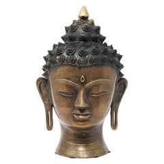 Tête de Bouddha en bronze moulé