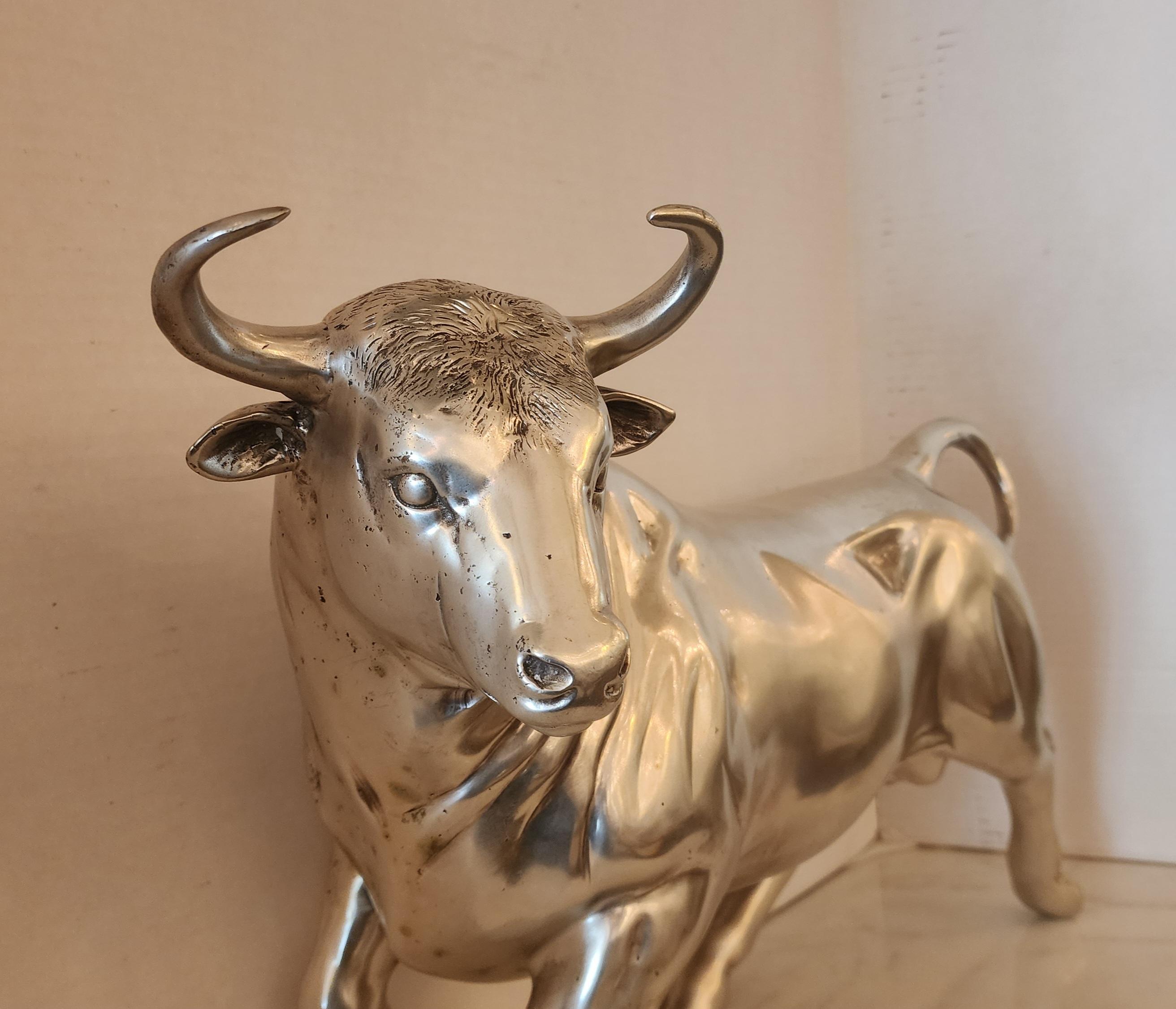 Vintage Cast bronze bull, with coin silver overlay. 