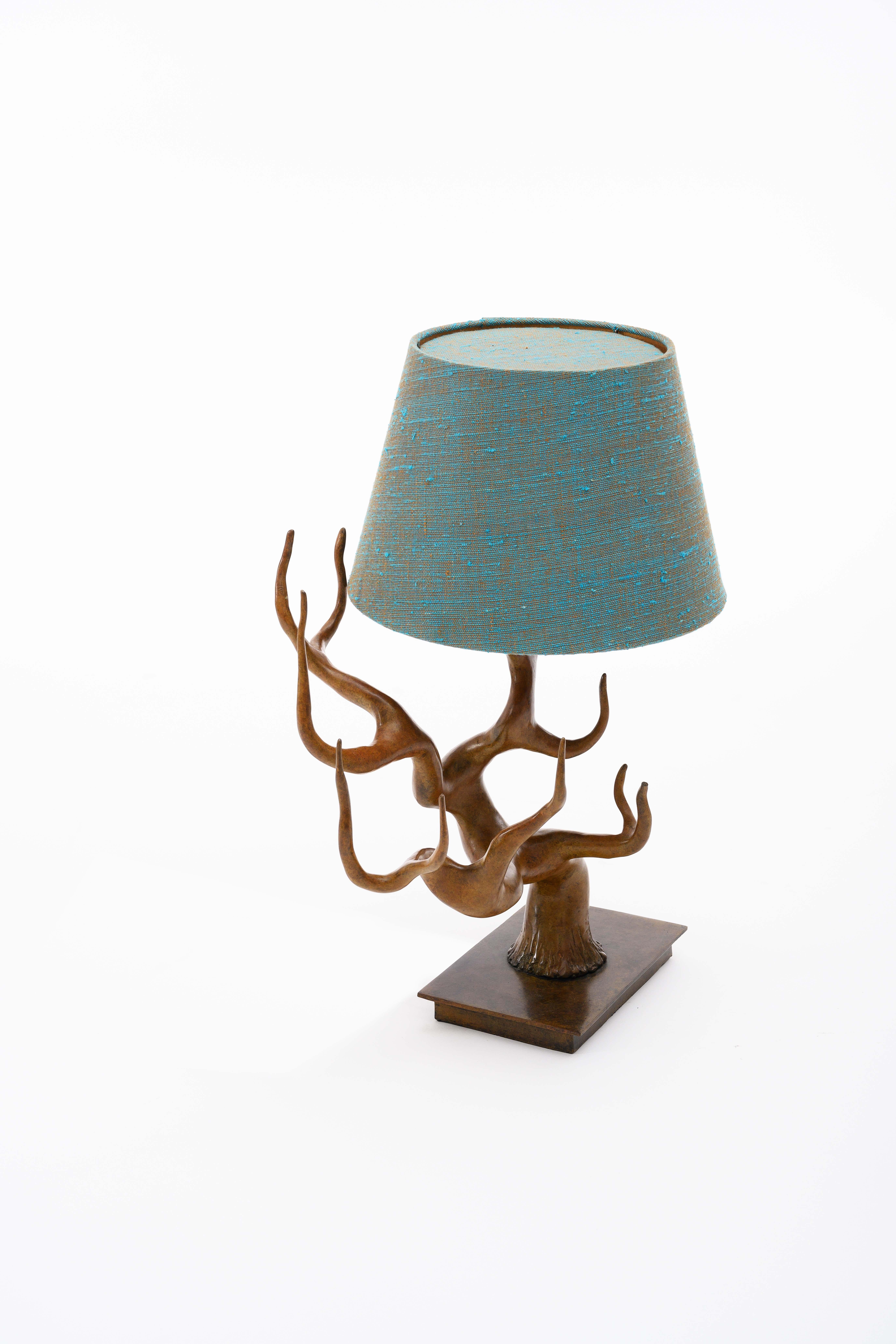 Cast Bronze Cervus Table Lamp with Blue Green Linen Shade by Elan Atelier
 
Bronze lamp with marine linen shade with gold silk interior, produced using the superior lost wax bronze casting process, hand-rubbed and finished in selected patina.  