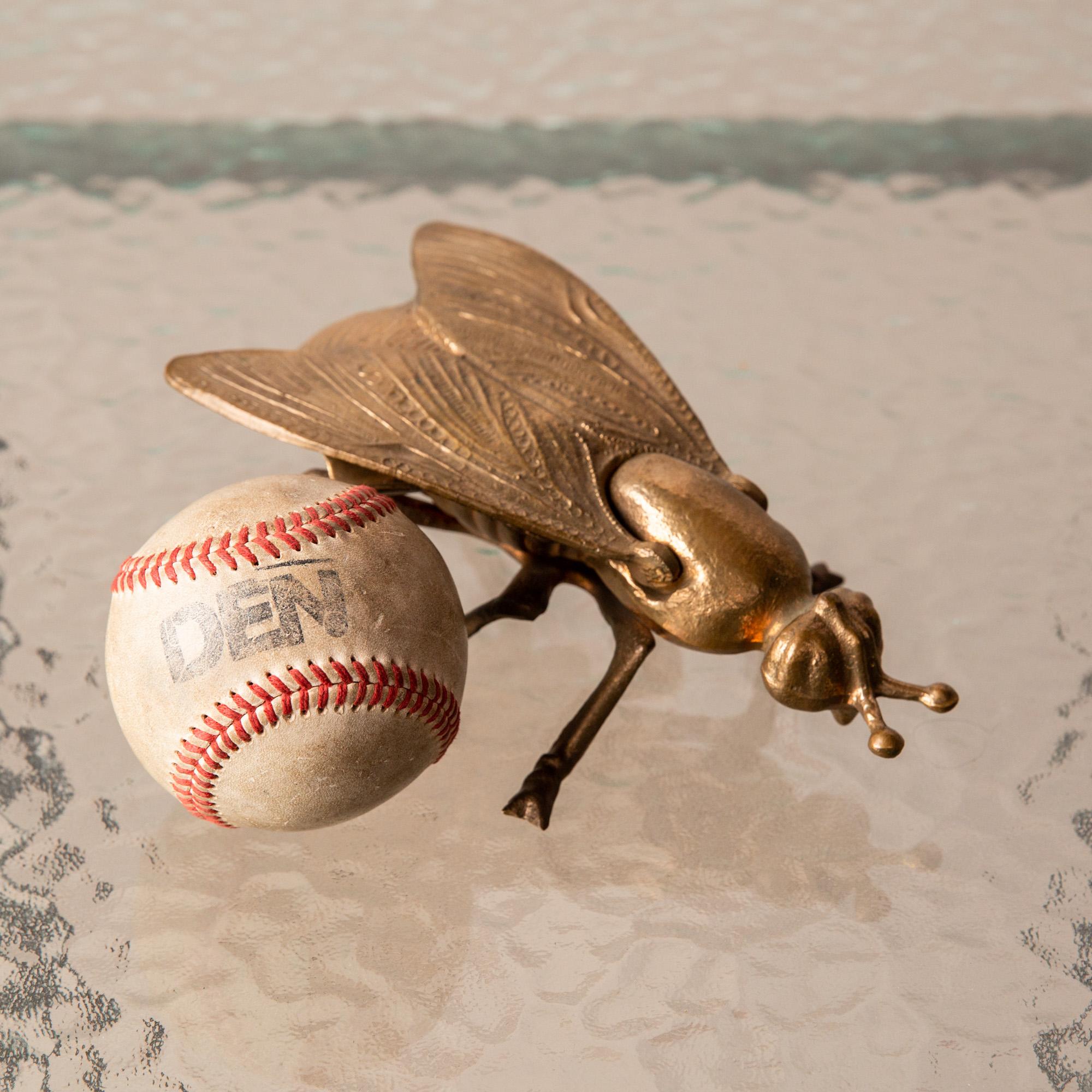 Bronze fly ashtray with subtle engraved detailing on the wings and tail. Hinged wings lift to reveal patinated ashtray with two grooves traditionally used to place the smoking accessory of choice. Solidly constructed, it shows little signs of wear