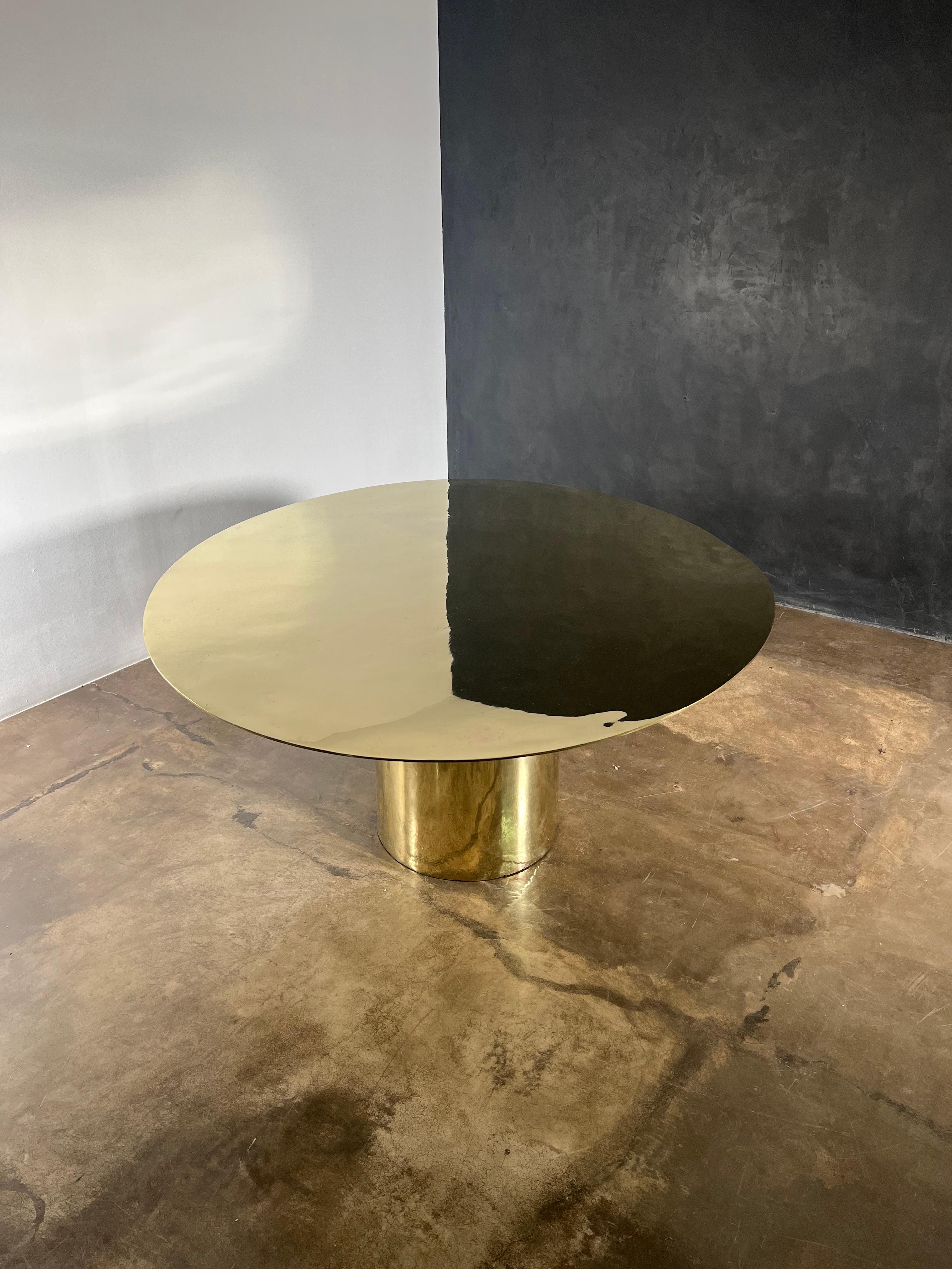 This cast bronze sculptural pedestal dining table from Costantini is truly a Functional Work of Art 

The top and base are cast separately and united with bronze screws so that the result is 100% bronze. Slight curves can be seen and felt in the