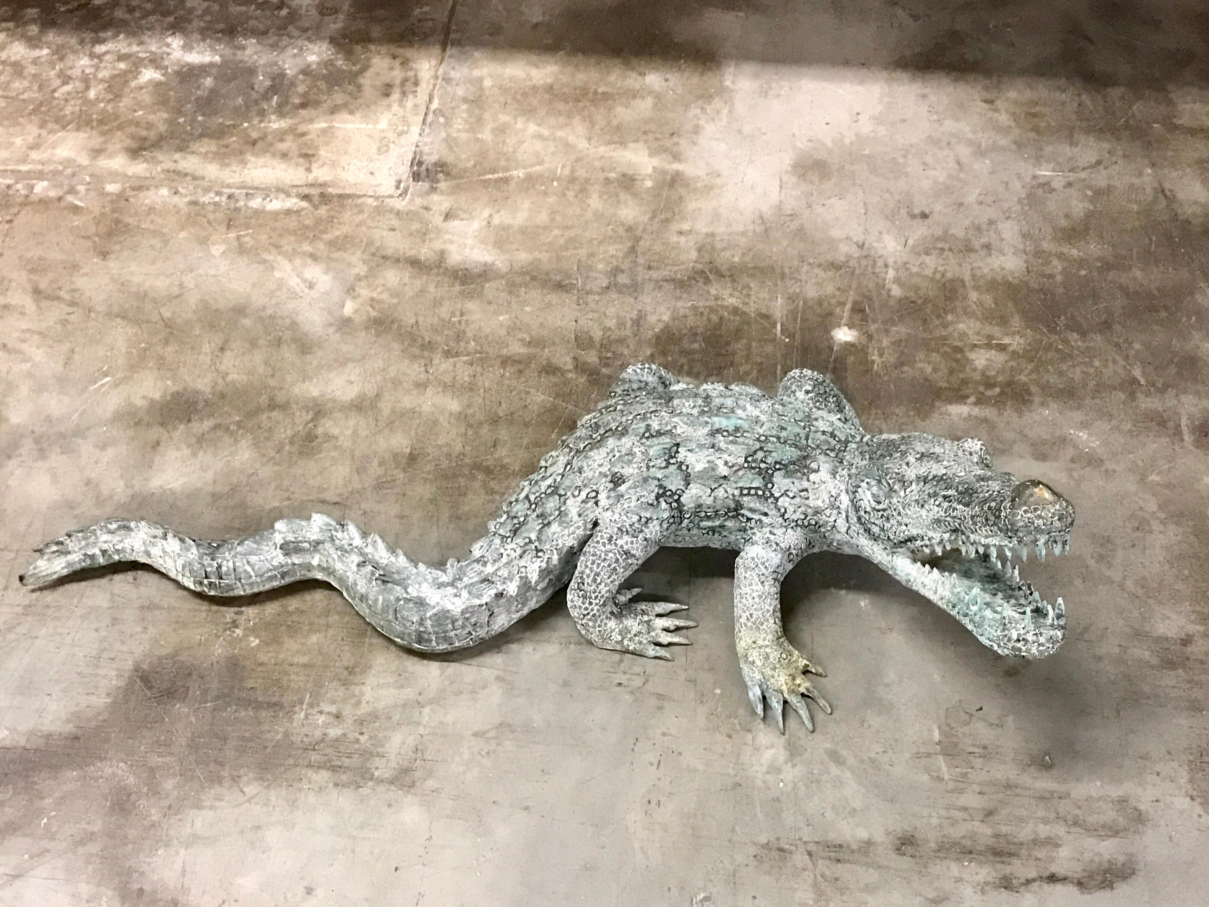 Cast bronze garden sculpture of an alligator, realistically cast with sharp teeth, great for indoor or outdoor use.