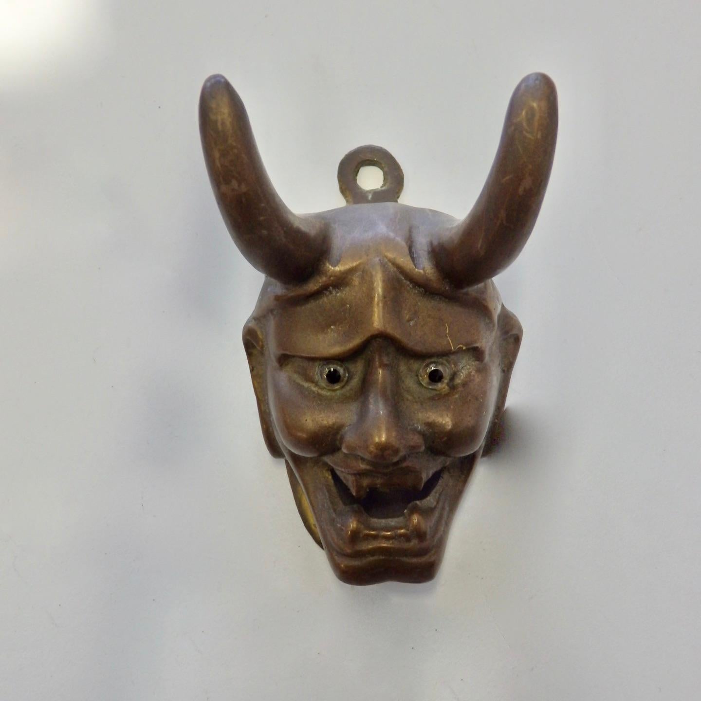 Frightening Devil image cast in bronze with spring clip holder. Glass eyes, stamped Arthur Court 1977.