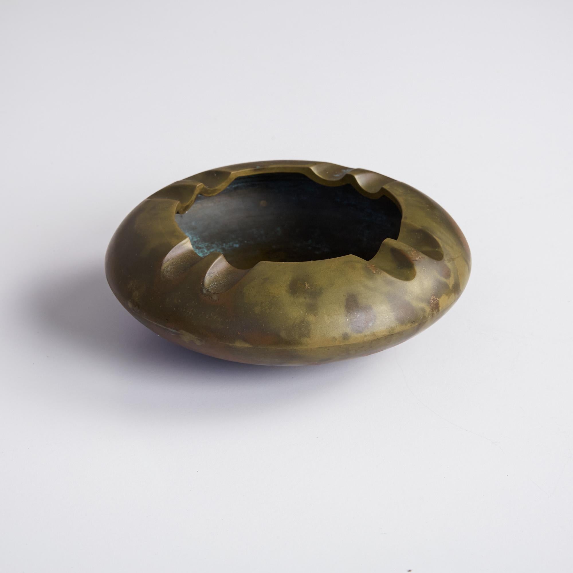 Our sales director here at DEN, Michael Alpert, has never smoked anything in his life. But he has concluded that this is the perfect ashtray. The patina on the bronze with slight hints of verdigris are paired well with the ¼” thickness of the bowl