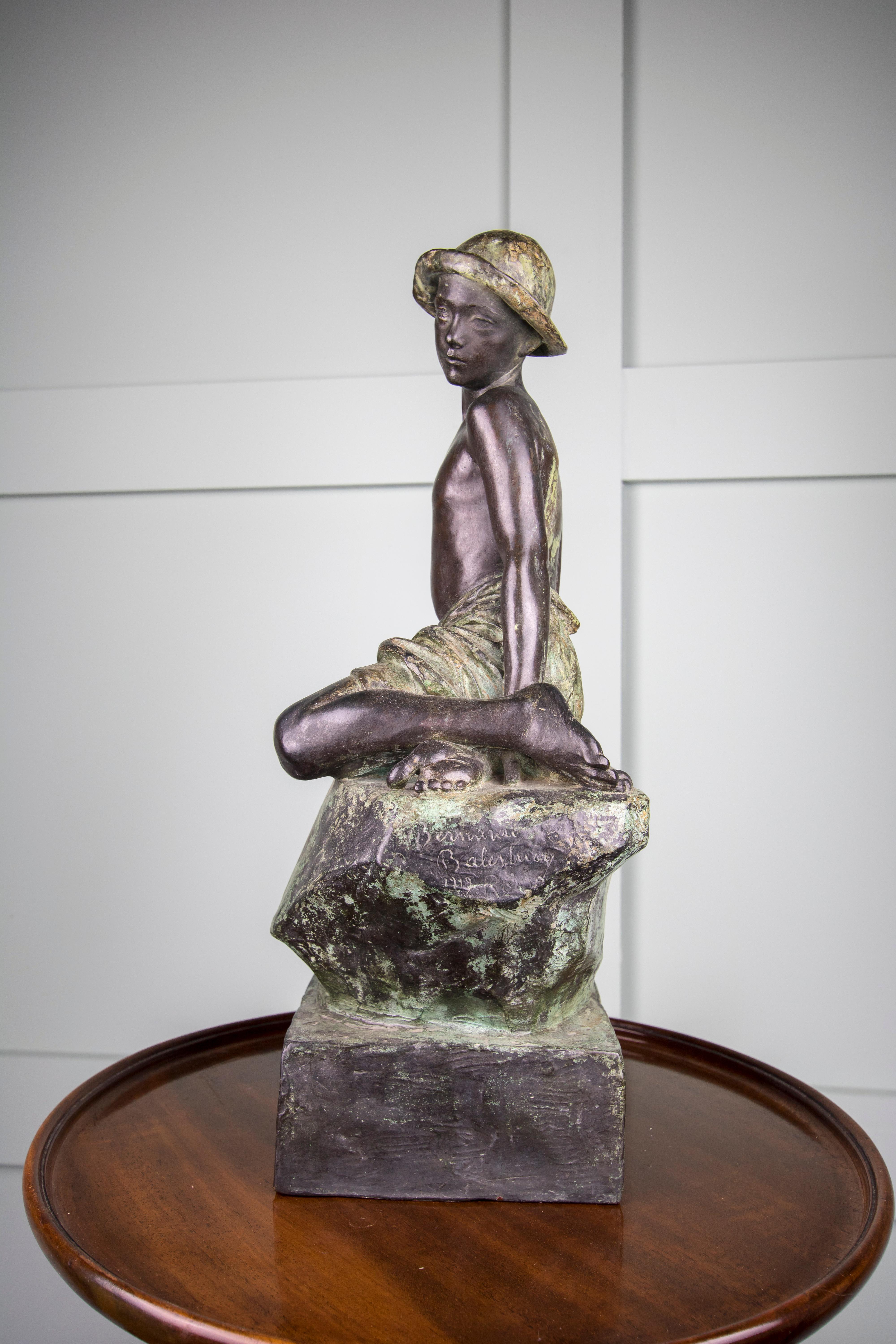 Early 20th Century Cast Bronze Sculpture of a Boy Sitting on a Rock, 1919, Rome For Sale