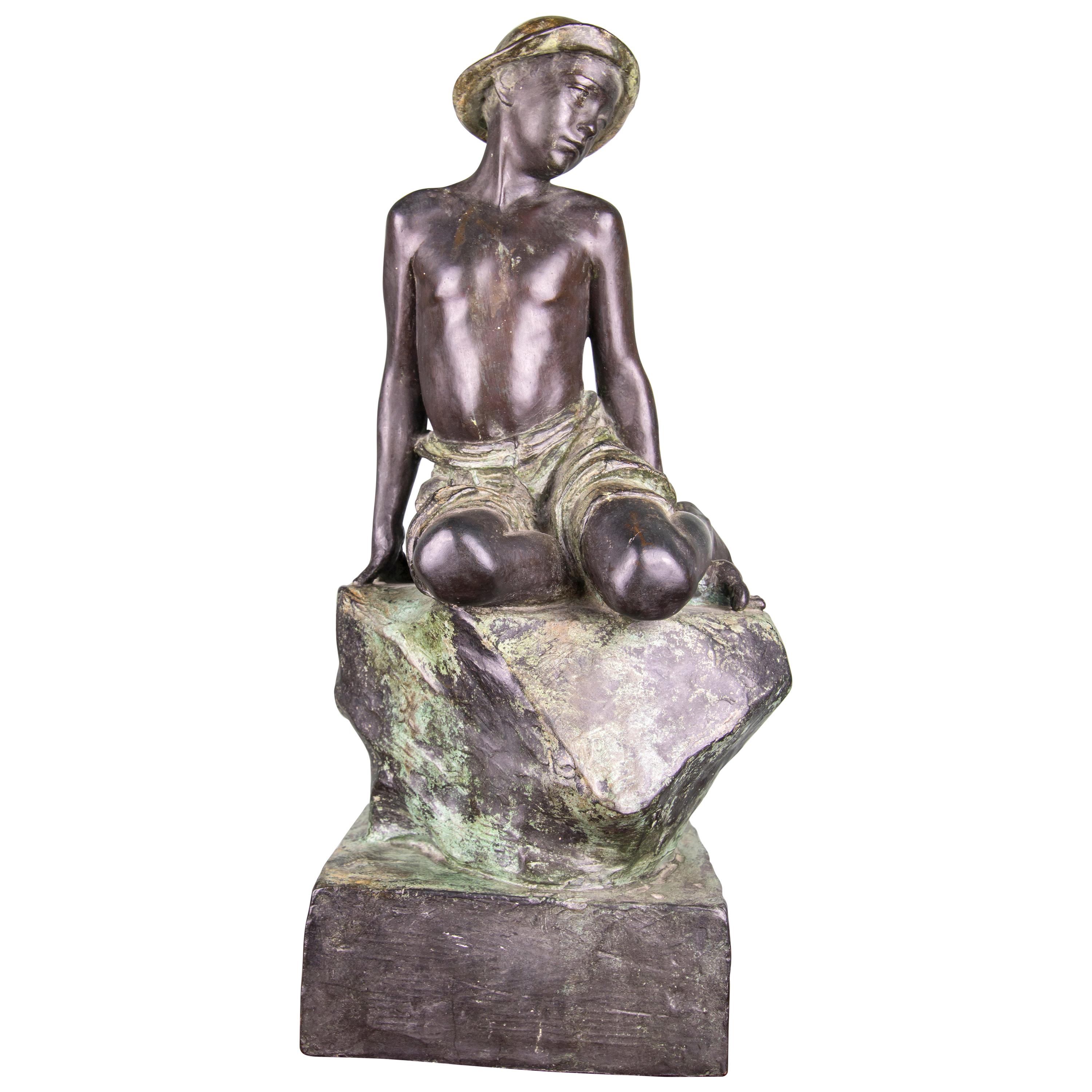 Cast Bronze Sculpture of a Boy Sitting on a Rock, 1919, Rome For Sale