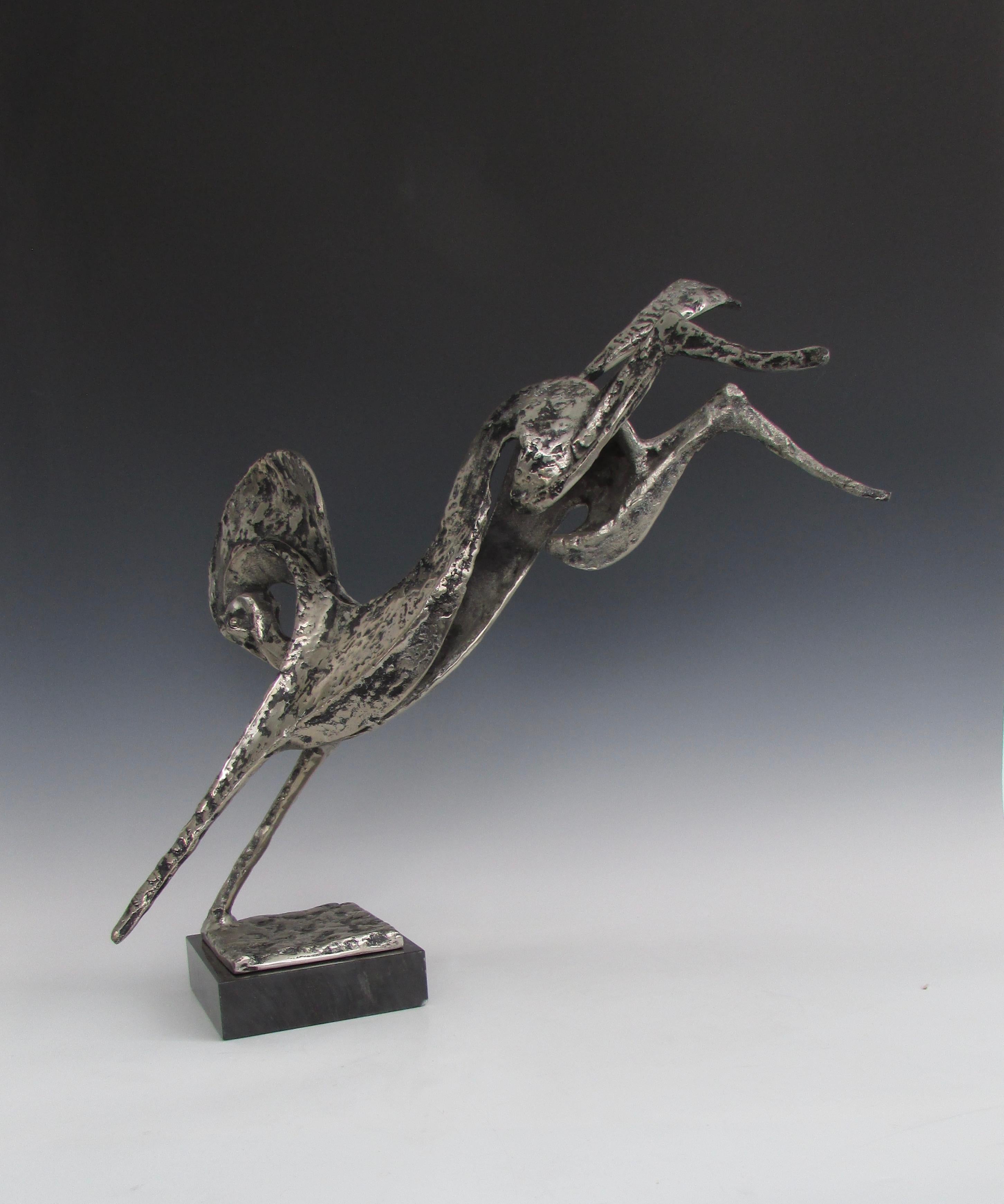 Beautifully scaled cast and plated sculpture of rearing horse on onyx base.