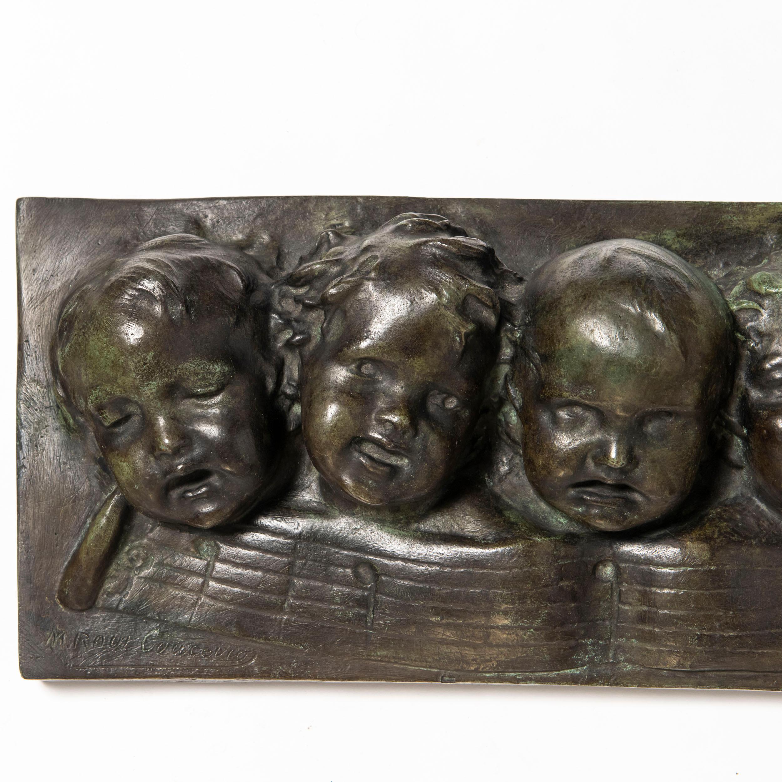 Cast bronze wall sculpture with seven children chorus. Europe, early 20th century.
Signed M. Raúl Couceiro.