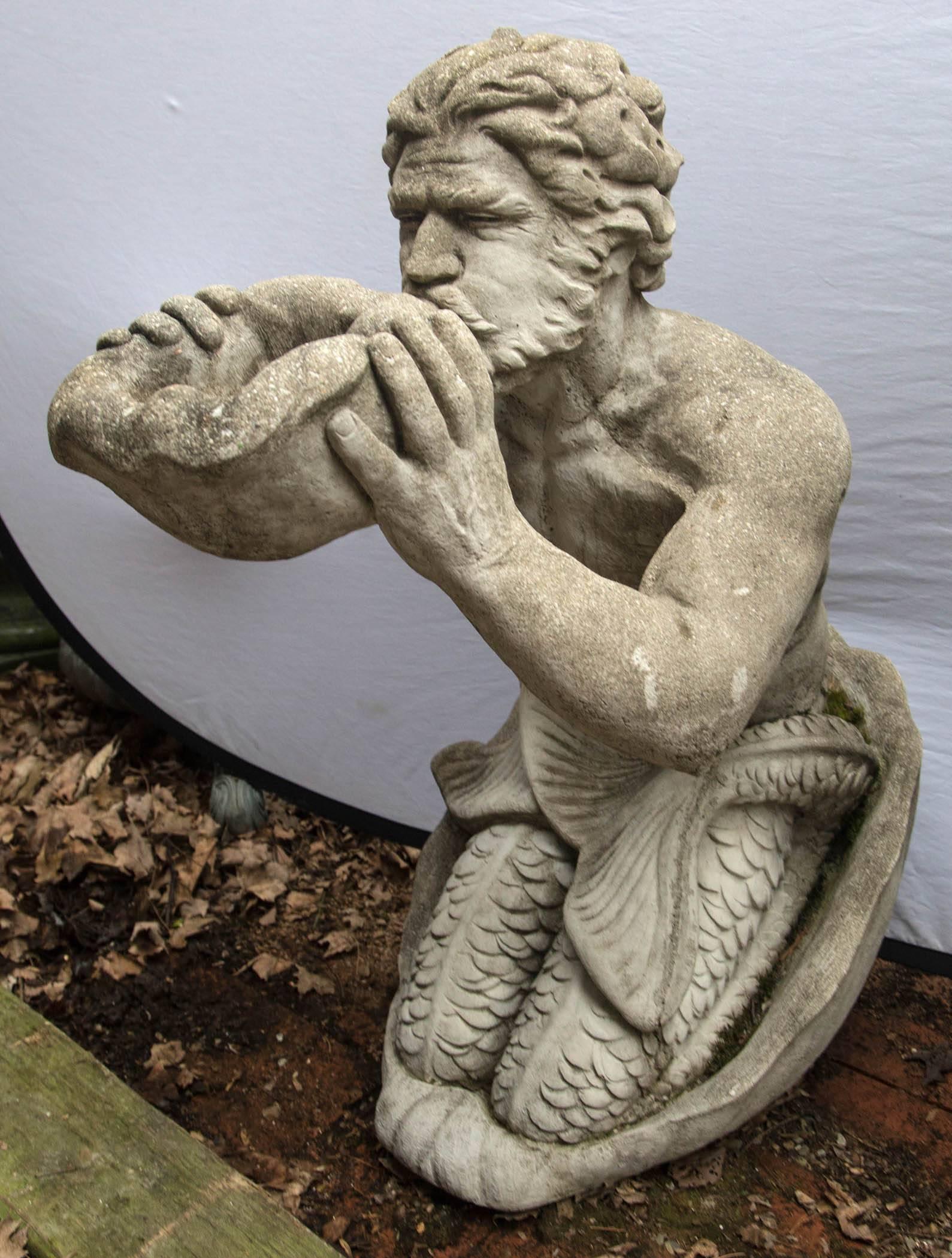 Triton is the merman son of Aphrodite and Poseidon. Here he is posed kneeling while holding a large shell which he uses as a signaling device. It is plumbed from underneath as a fountain, with water rising from the shell at his mouth.
Very well