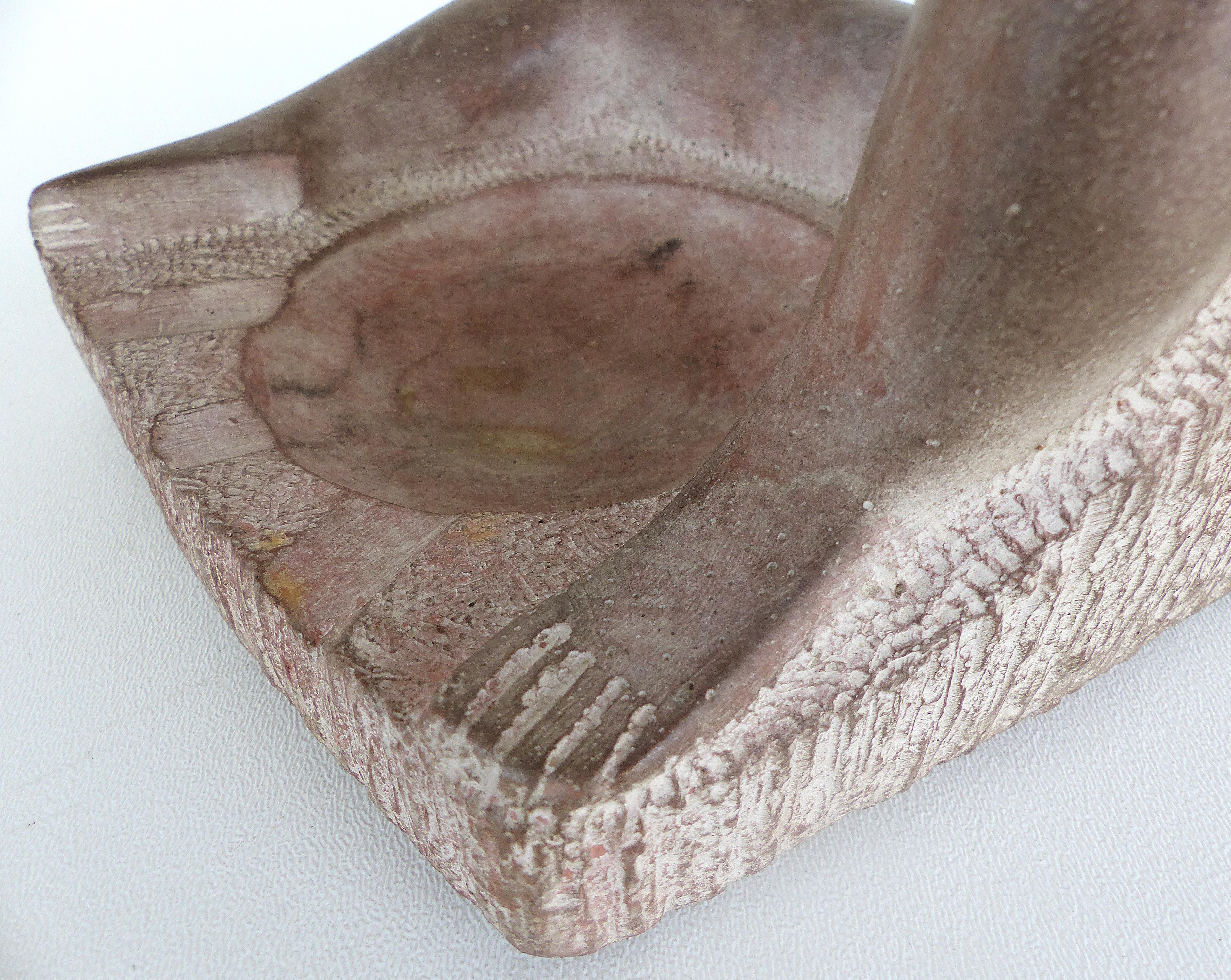 Offered for sale is a cast composition erotic figural sculptural ashtray of a reclining nude by artist Chuck Dodson, circa 1975. Dodson was an architect turned sculptor that was a resident artist at the Grove house in Coconut Grove, FL. His
