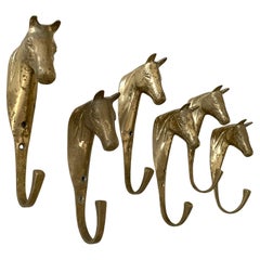 Percheros de pared con cabeza de caballo de metal fundido dorado - 4 disponibles