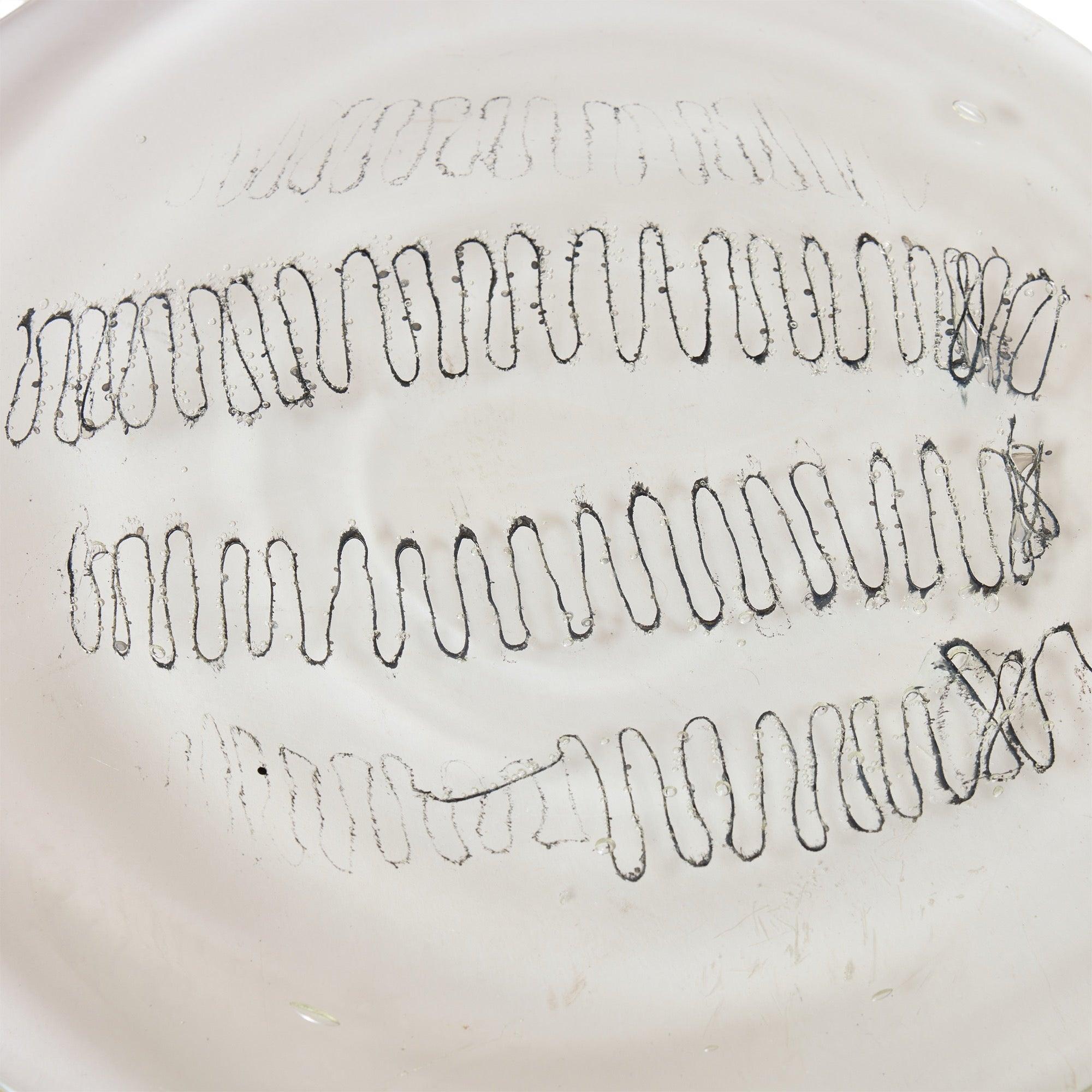 Artist Made Cast Glass Dish with threads of fabric inside.