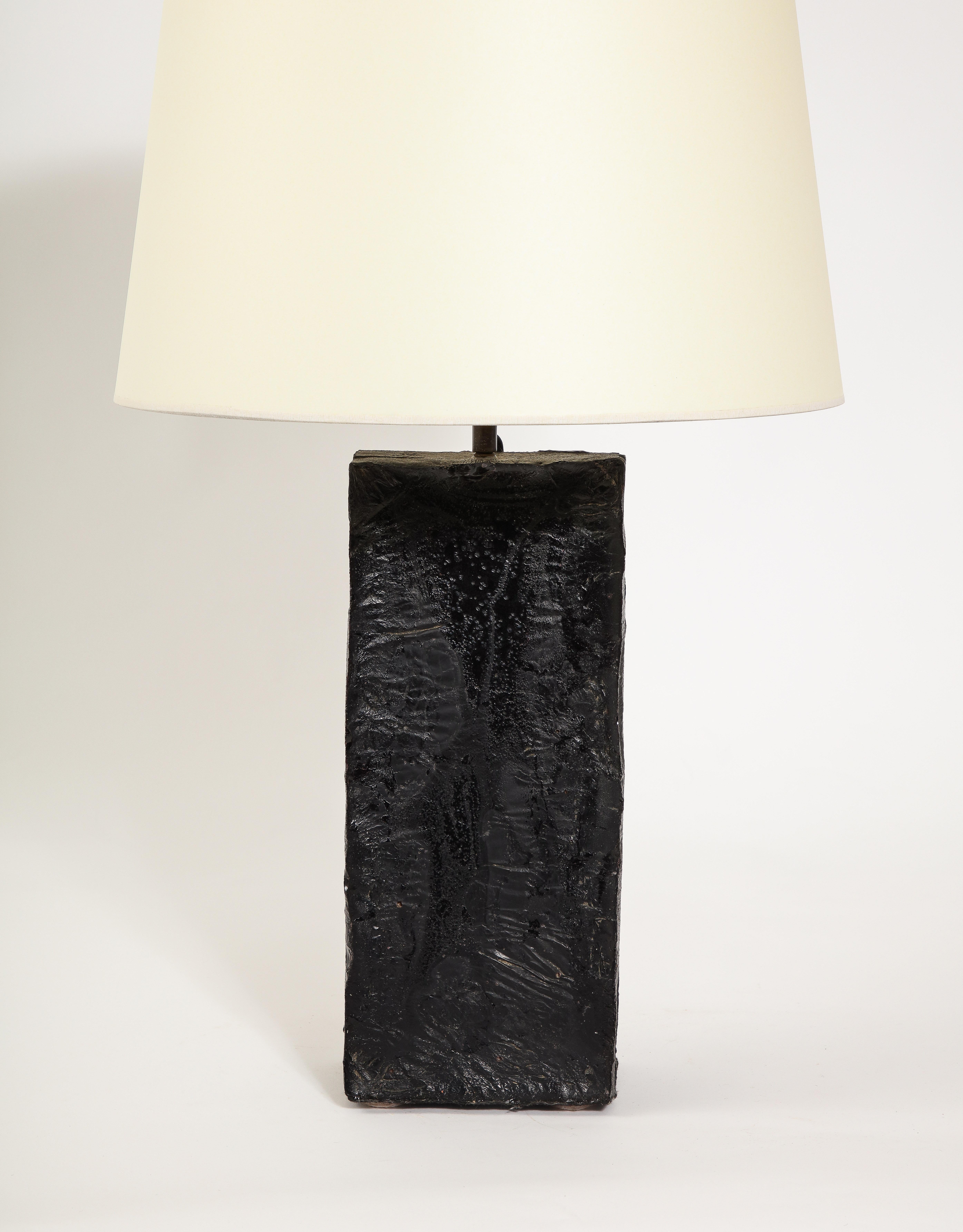 Heavy solid glass cast black table lamp with a rough texture

19x6x4 Base Only

