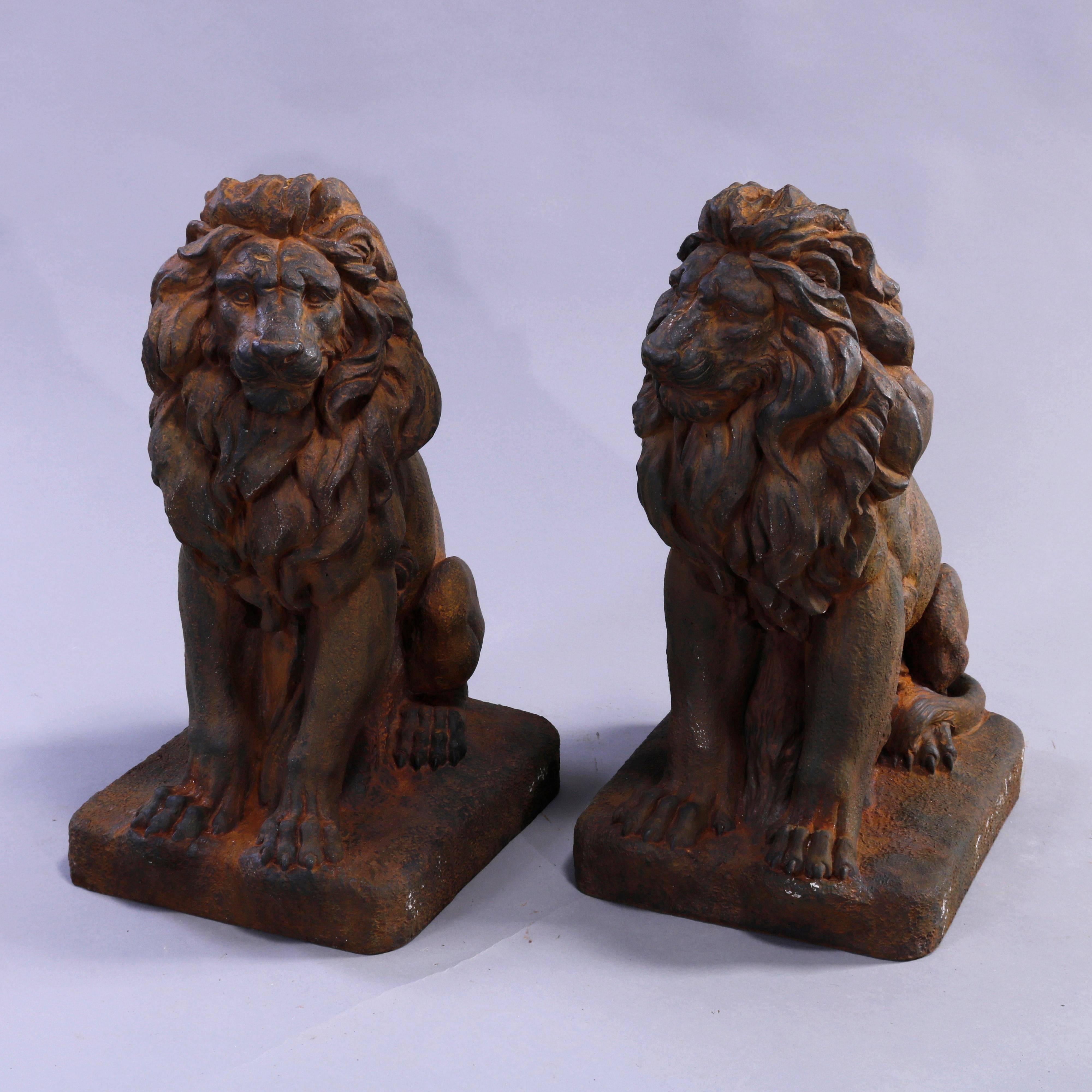 A pair of figural garden sculptures offer bronzed cast hard stone Classical lions in the seated position, 20th century.

Measures - 21.5