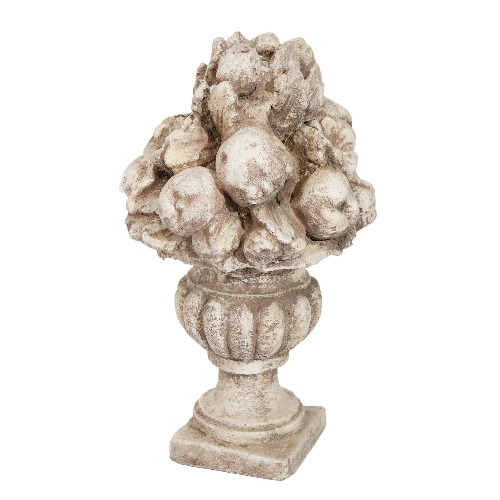 An ornamental garden sculpture offers cast stone construction with fruit and floral melon form urn, 20th century

Measures - 19