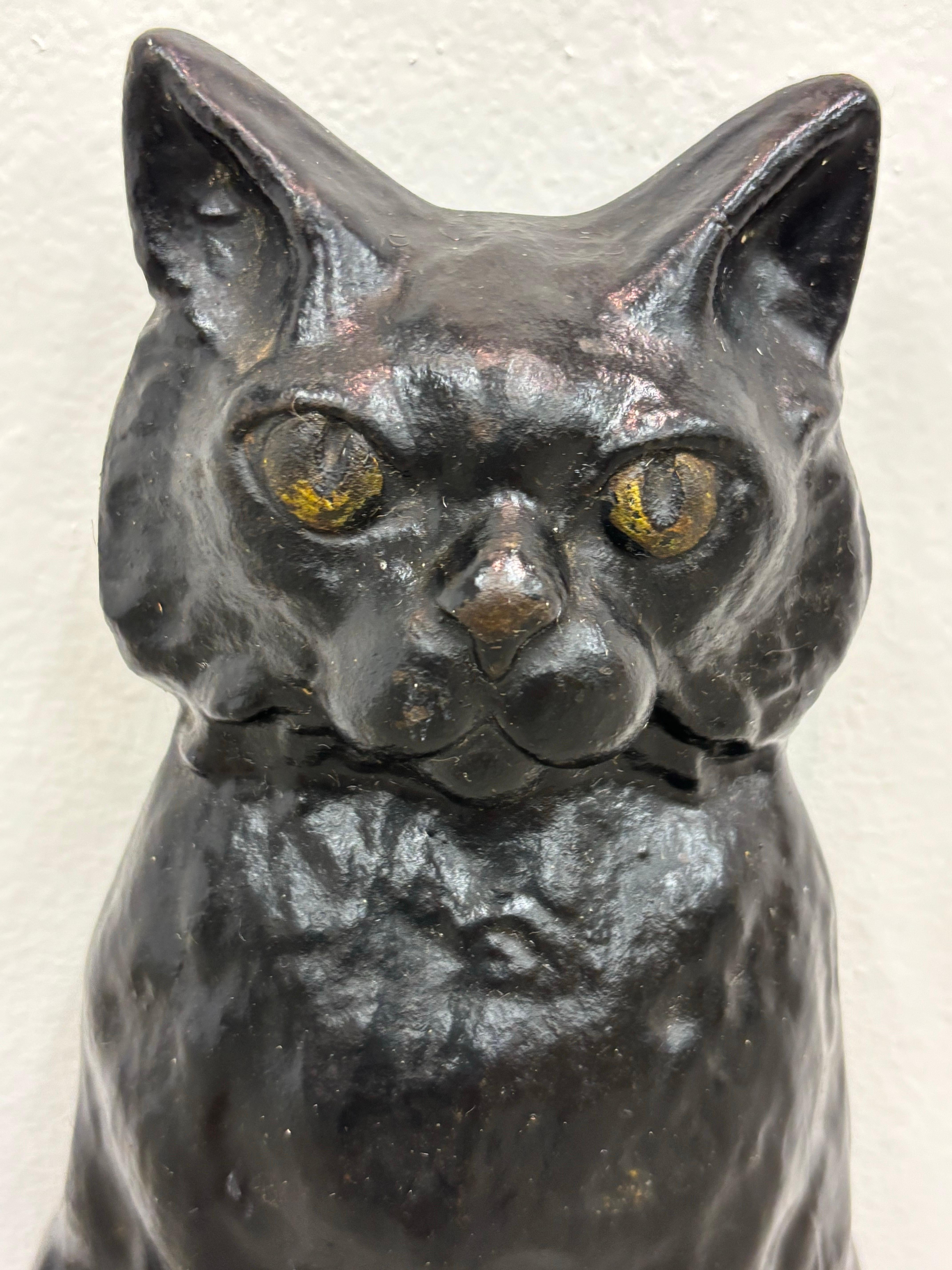 Large Cast Iron Cat Door Stop.  Just cleaned and oiled the cat up!  Overall very original with old paint.  Very solid and heavy!  It will hold your door open!