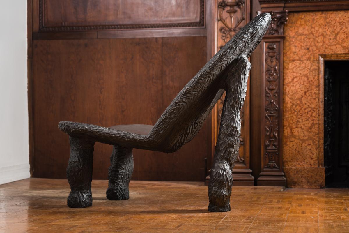 This is a sculptural chair of cast iron that serves as statement anywhere in the home, or as a functional outdoor sculpture. Listed price is for piece as shown, which is not in an outdoor finish. A surcharge of $3,000 will be made for the