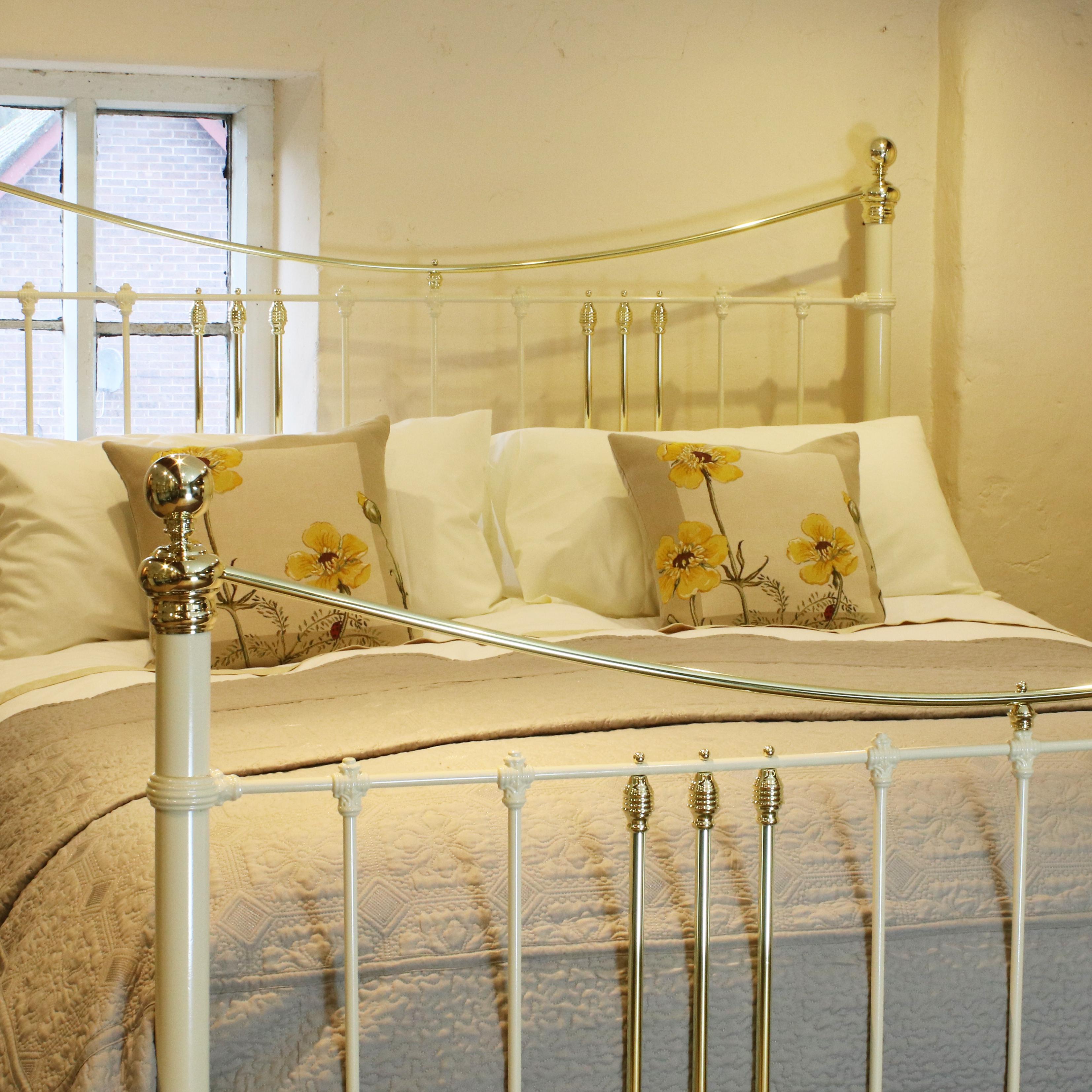 A cast iron and brass bed adapted from an original Victorian bed finished in cream, with curved brass top rails and decorative mouldings adapted from a frame. 

This bed accepts a British Super King Size or Californian King Size (6ft wide, 72 inches