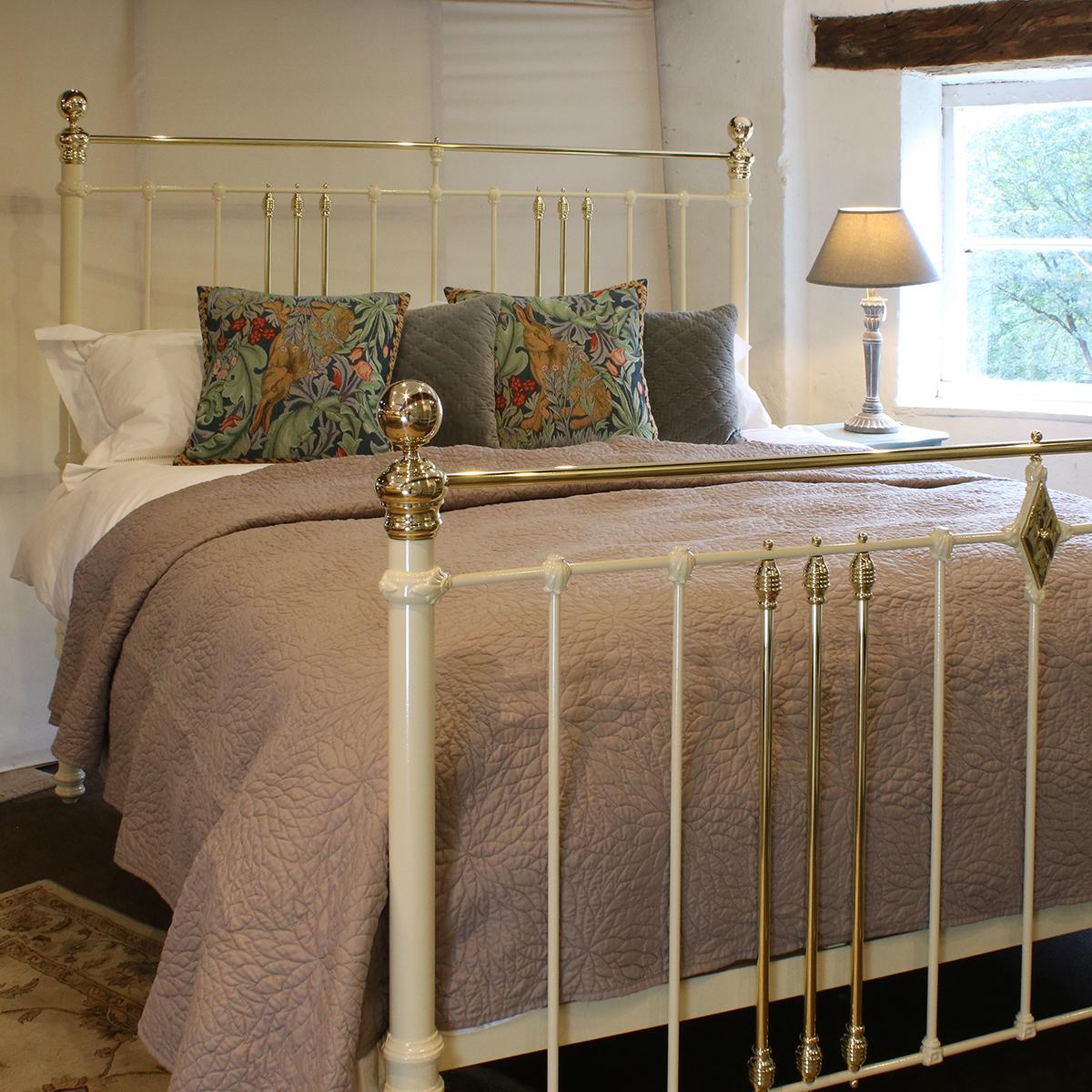 Cast iron and brass bed finished in cream with straight brass top rails and decorative central diamond rosette. Adapted to the 6'0 width from an original Victorian frame. 

This bed accepts a UK Super King or Californian King Size (6ft, 72 in. or