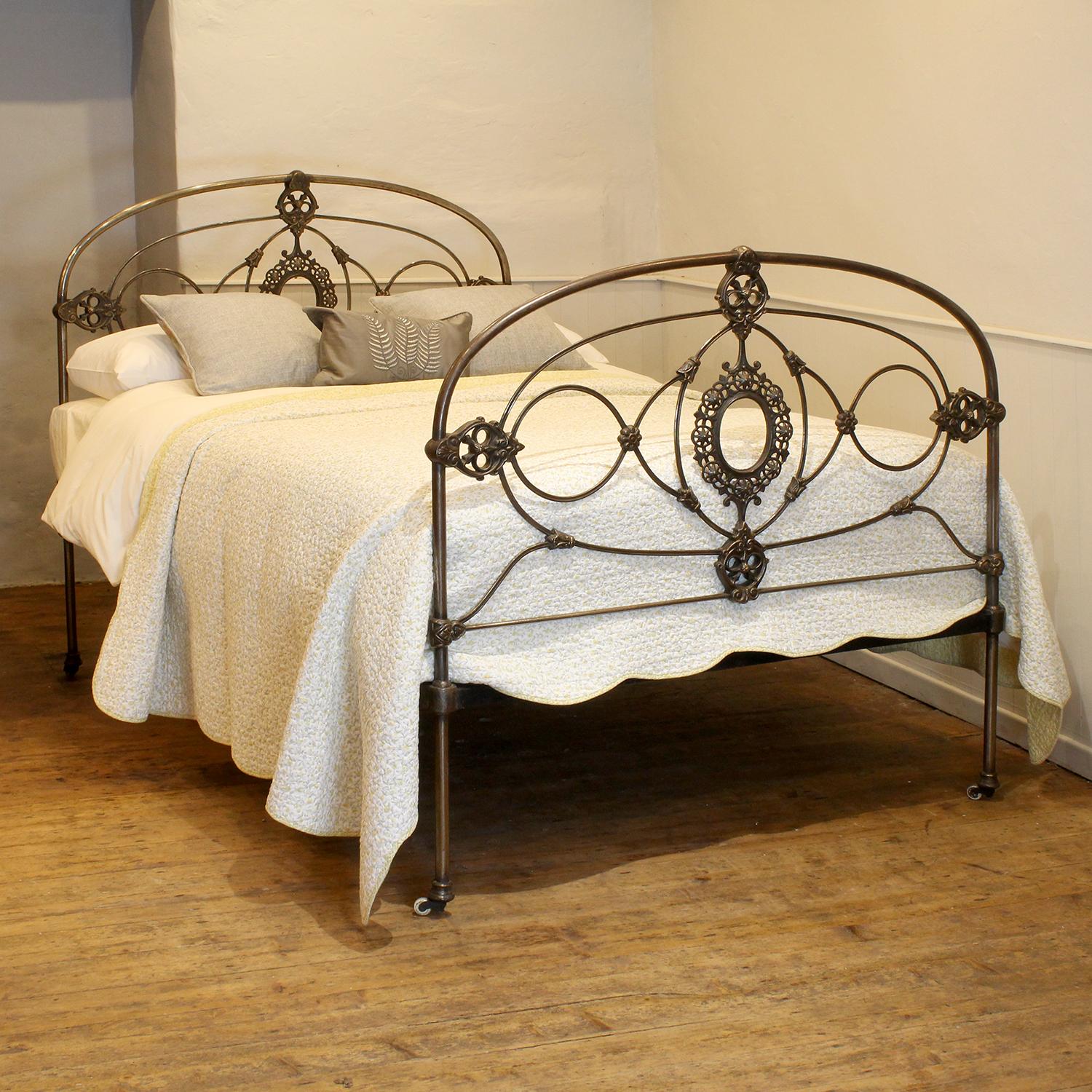 A fabulous double bed with arch design and ornate castings in polished cast iron and steel. This superb piece is one of the finest examples of decorative ironwork made at the height of the Victorian era. It was originally manufactured in one of the