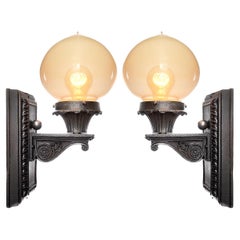 Antique Cast Iron and Vaseline Glass Sconces